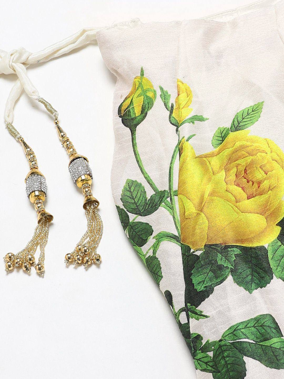 Yellow rose print ethnic gown with gold tassel detailing, perfect for Indian festive wear