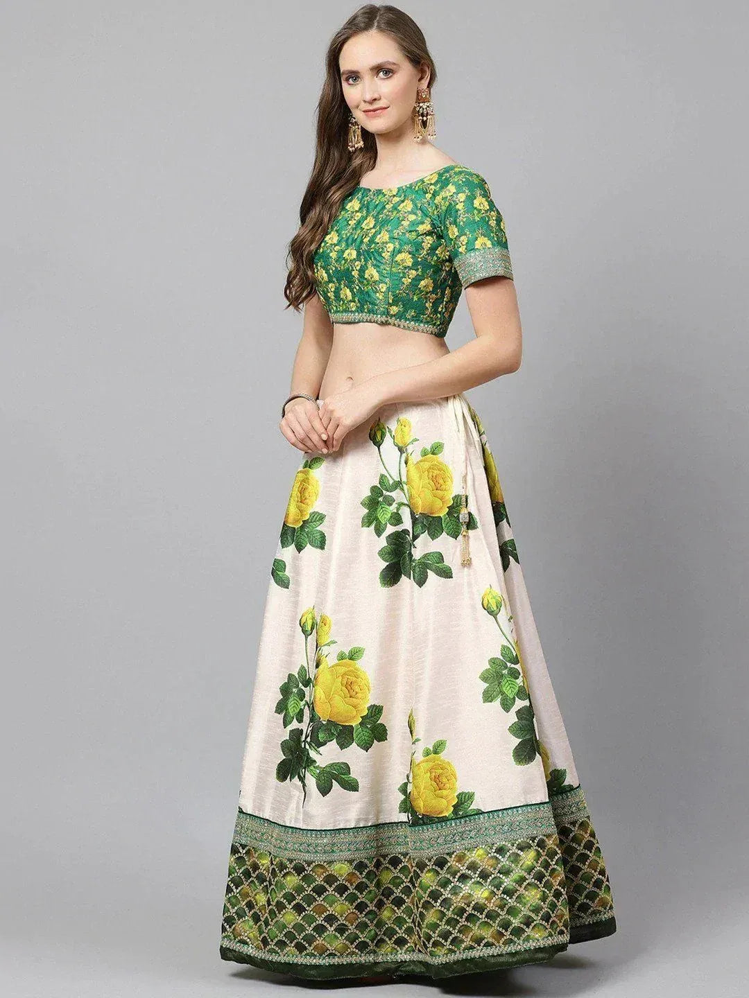 Green floral crop top with cream lehenga featuring yellow rose print and embroidered border, ethnic wear