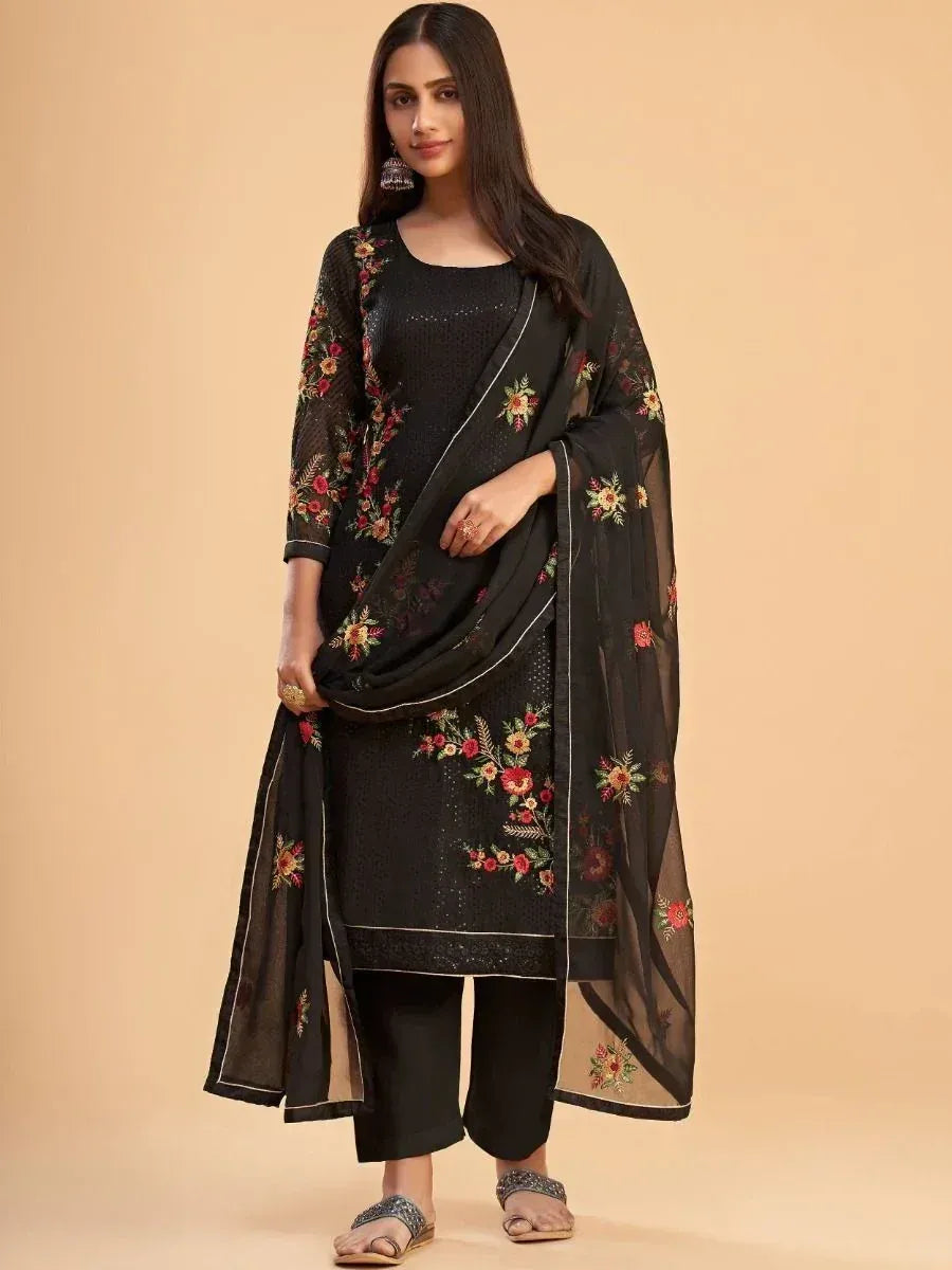 Woman in black floral embroidered salwar kameez with dupatta, Indian ethnic wear