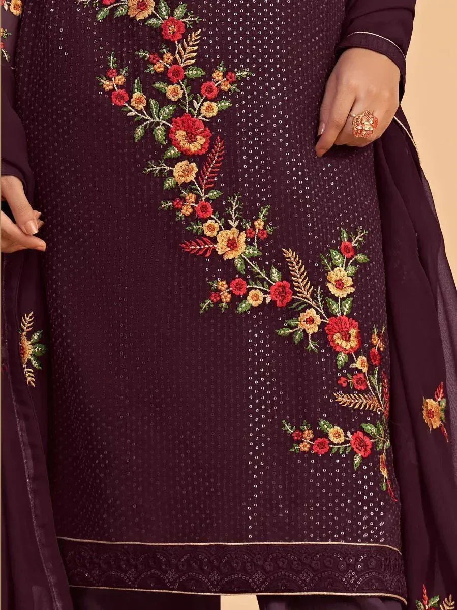Purple ethnic salwar kameez with floral embroidery and sequin detailing, perfect for festive occasions