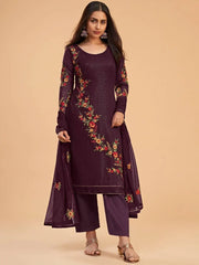 Woman in maroon embroidered salwar kameez set from Ethnic Plus, standing indoors