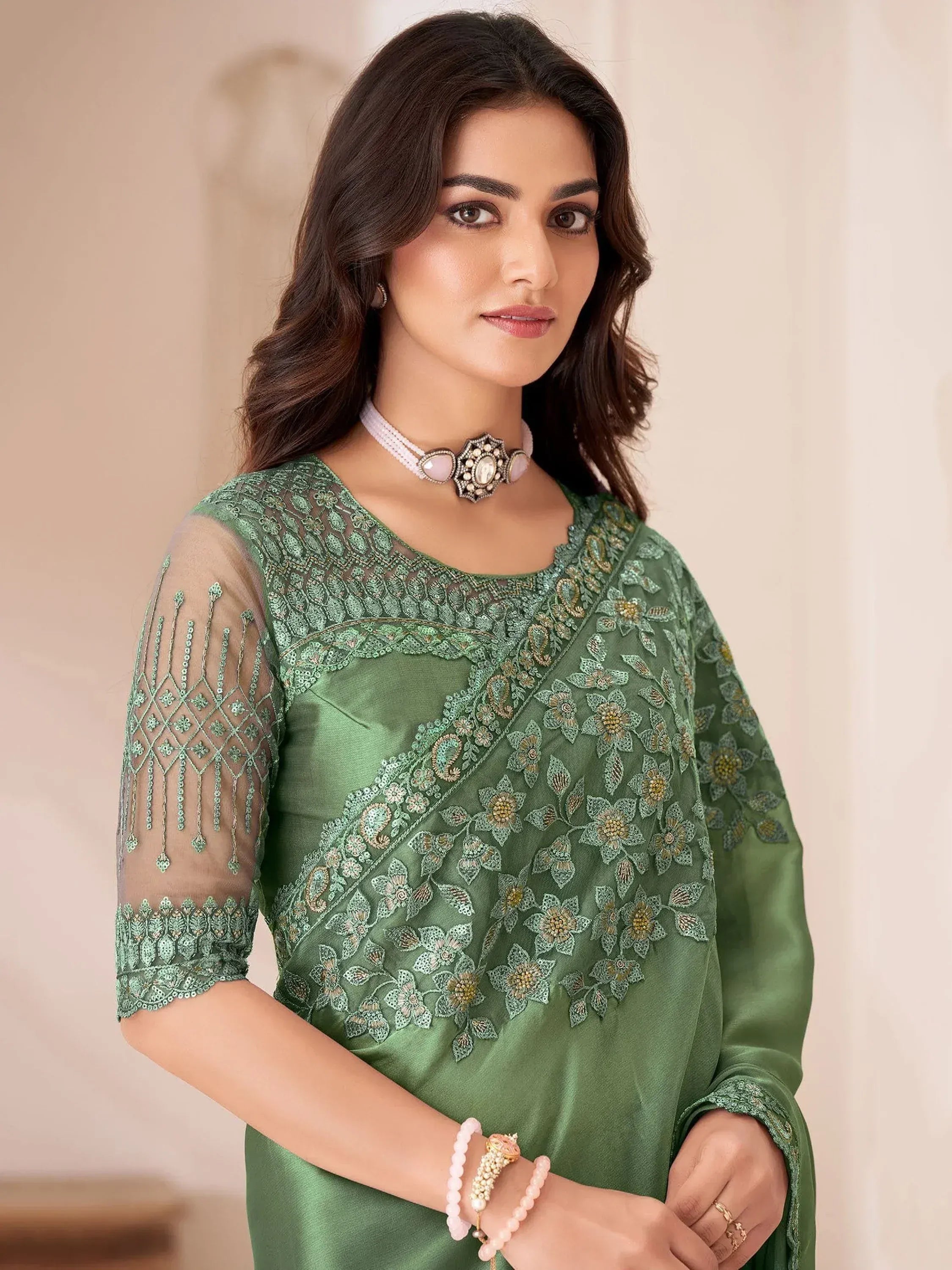 Green embroidered ethnic kurti with sheer sleeves, floral zari work, perfect for Indian occasions and parties.