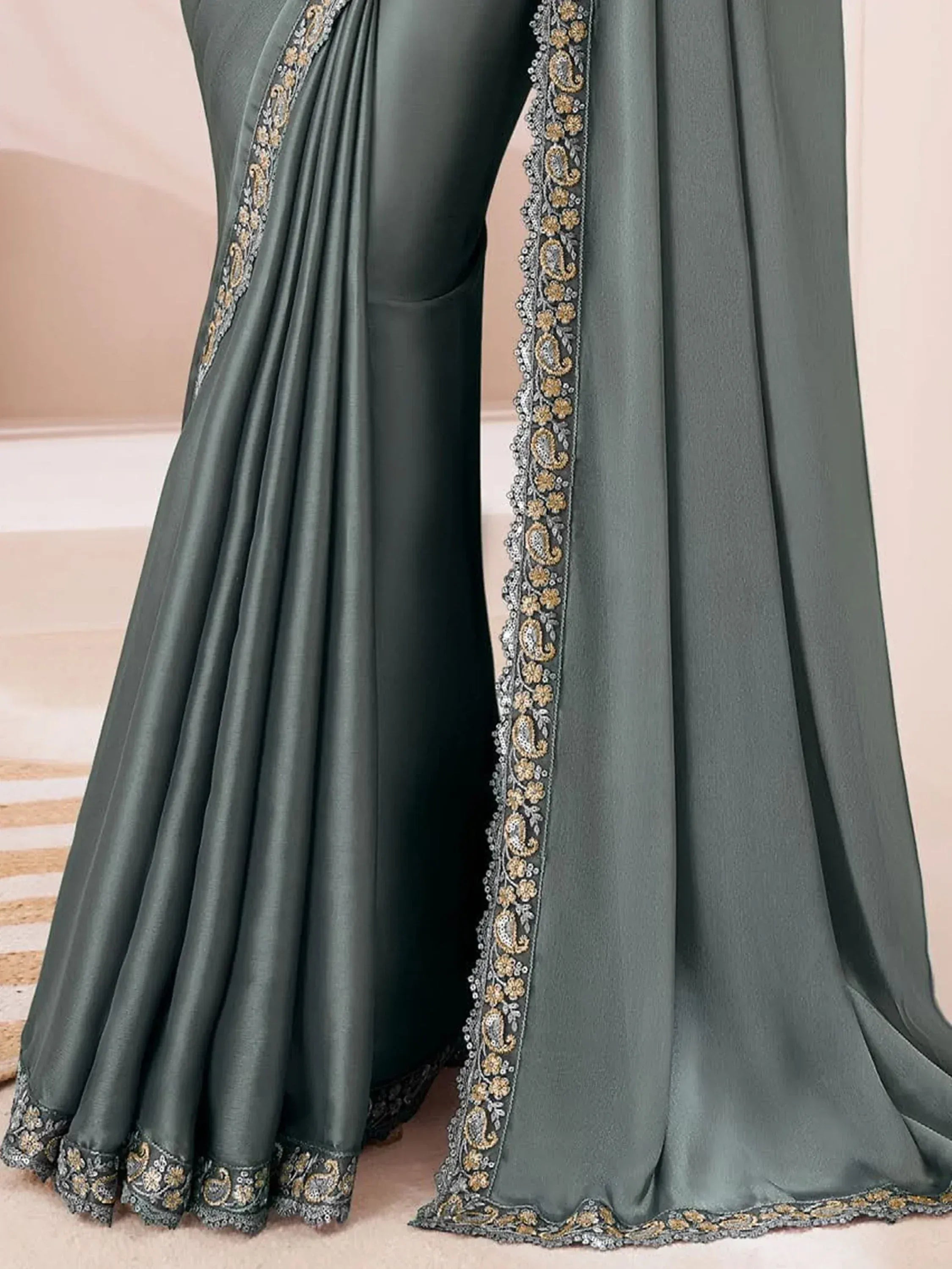 Dark green satin saree with gold and silver floral paisley embroidery, elegant Indian ethnic wear