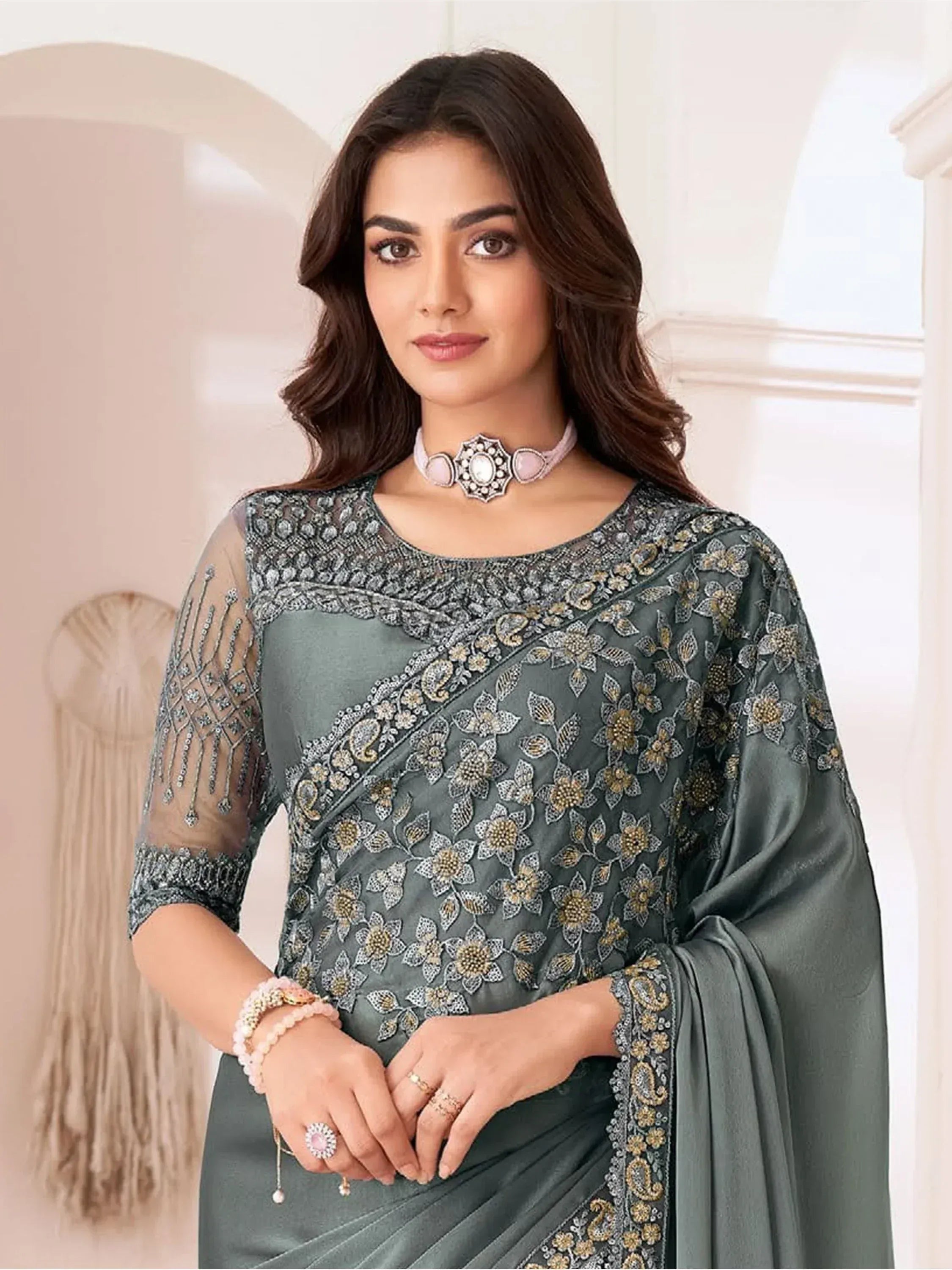 Elegant grey embroidered saree with floral motifs and sheer sleeves, perfect for Indian ethnic wear occasions.