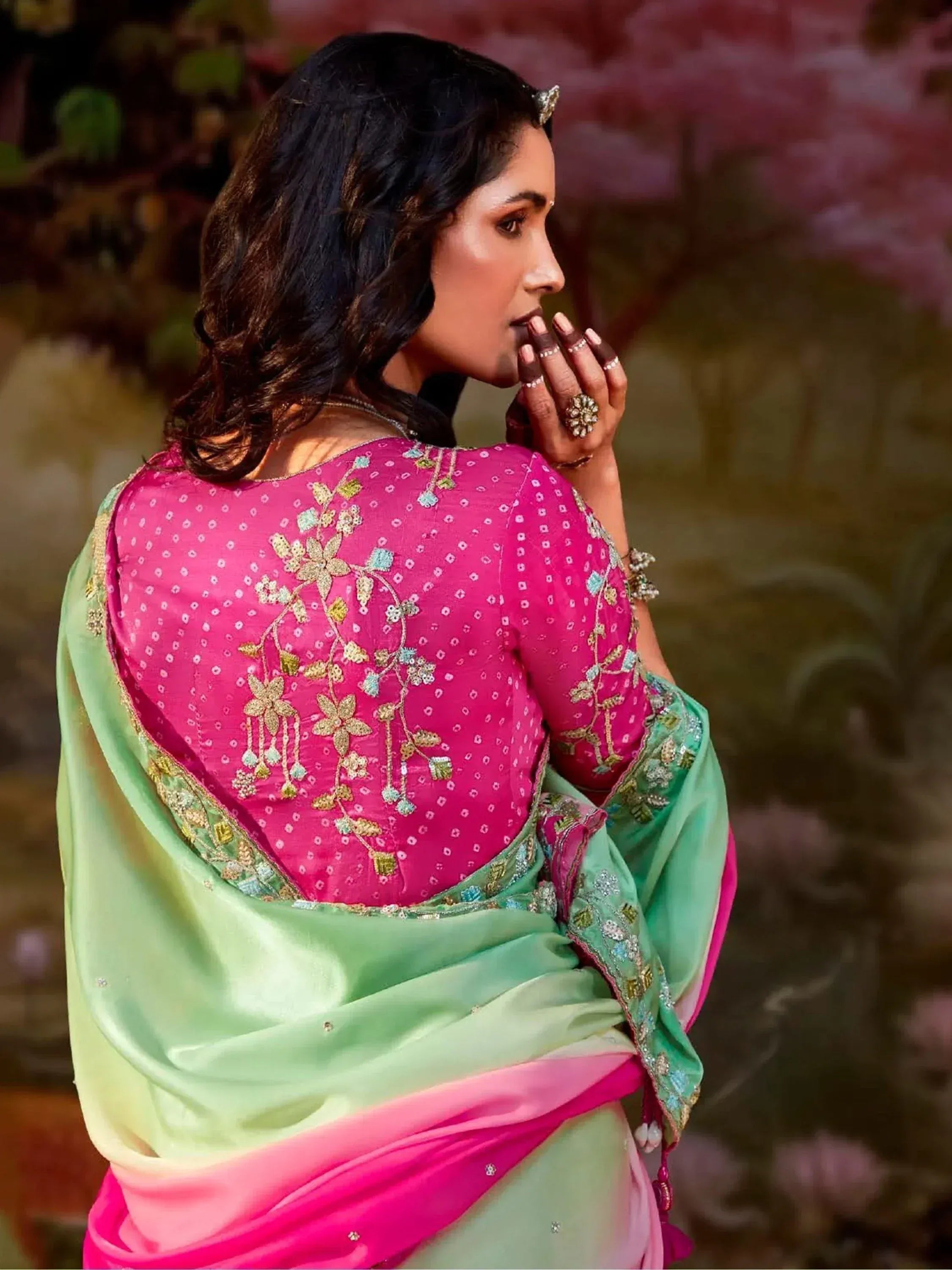 Pink and green embroidered saree with floral design, perfect for Indian ethnic occasions
