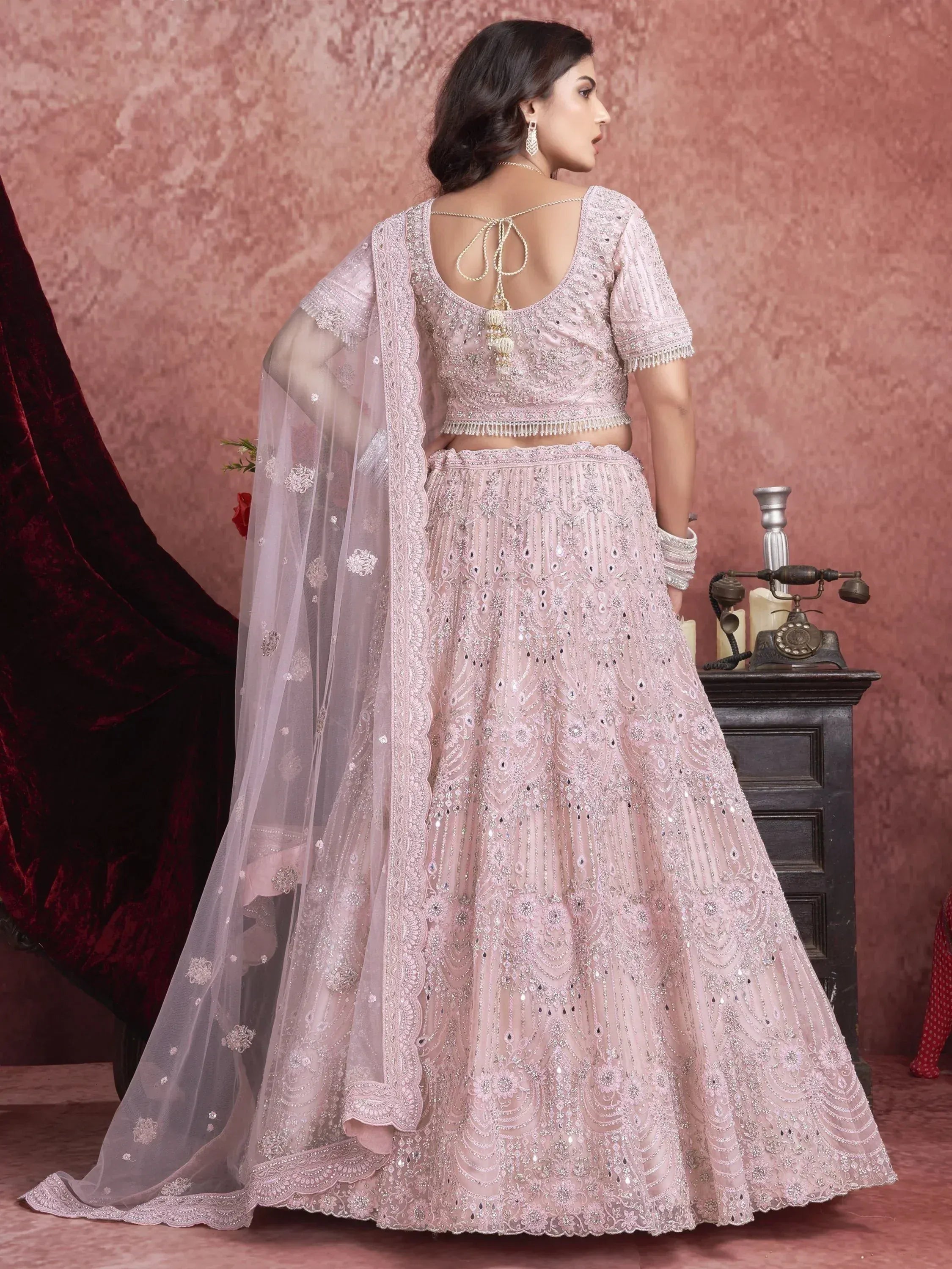 Pink embroidered lehenga choli with sheer dupatta, perfect for Indian weddings and festive occasions