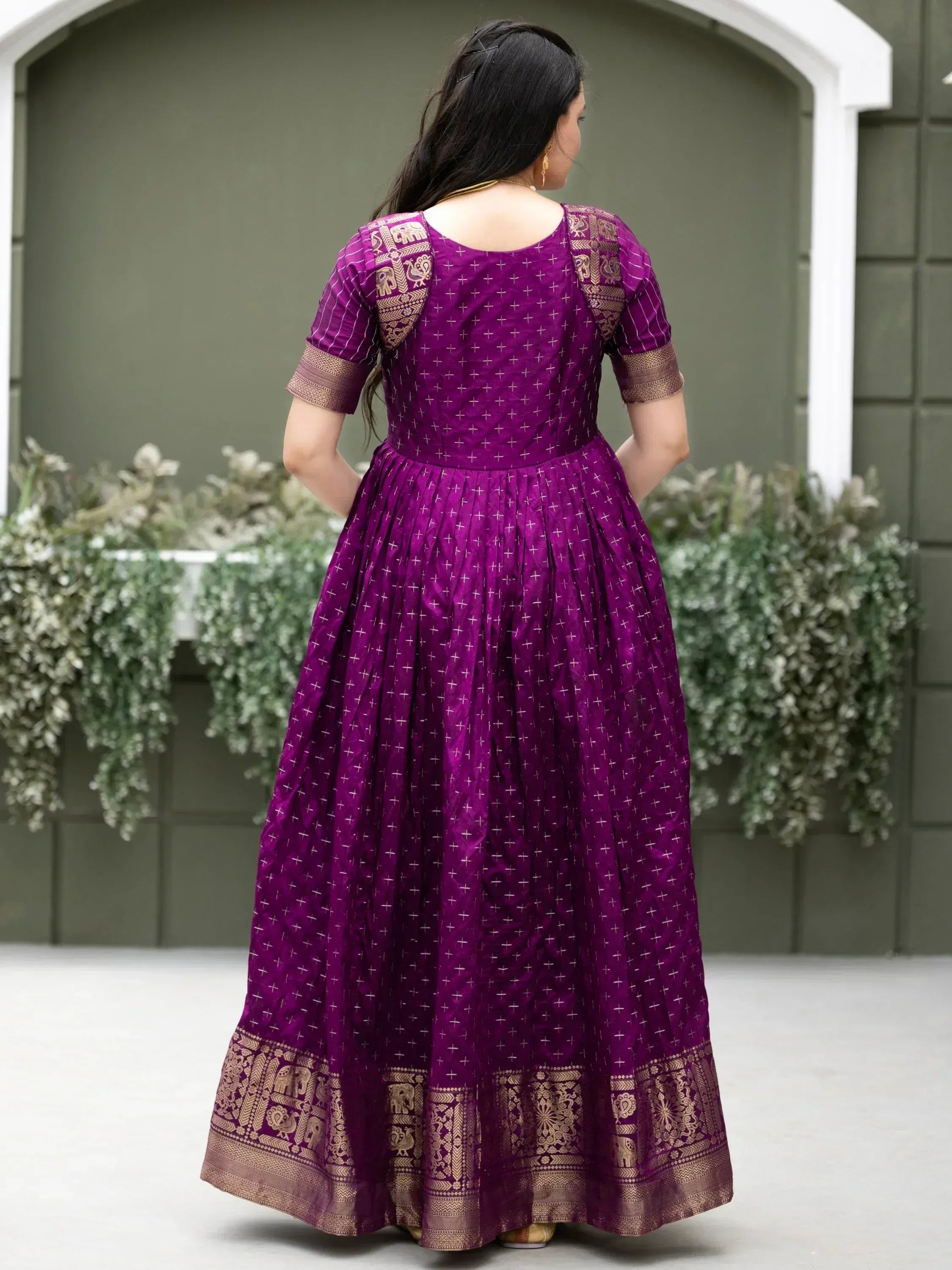 Purple ethnic gown with gold elephant print and cross motifs, back view