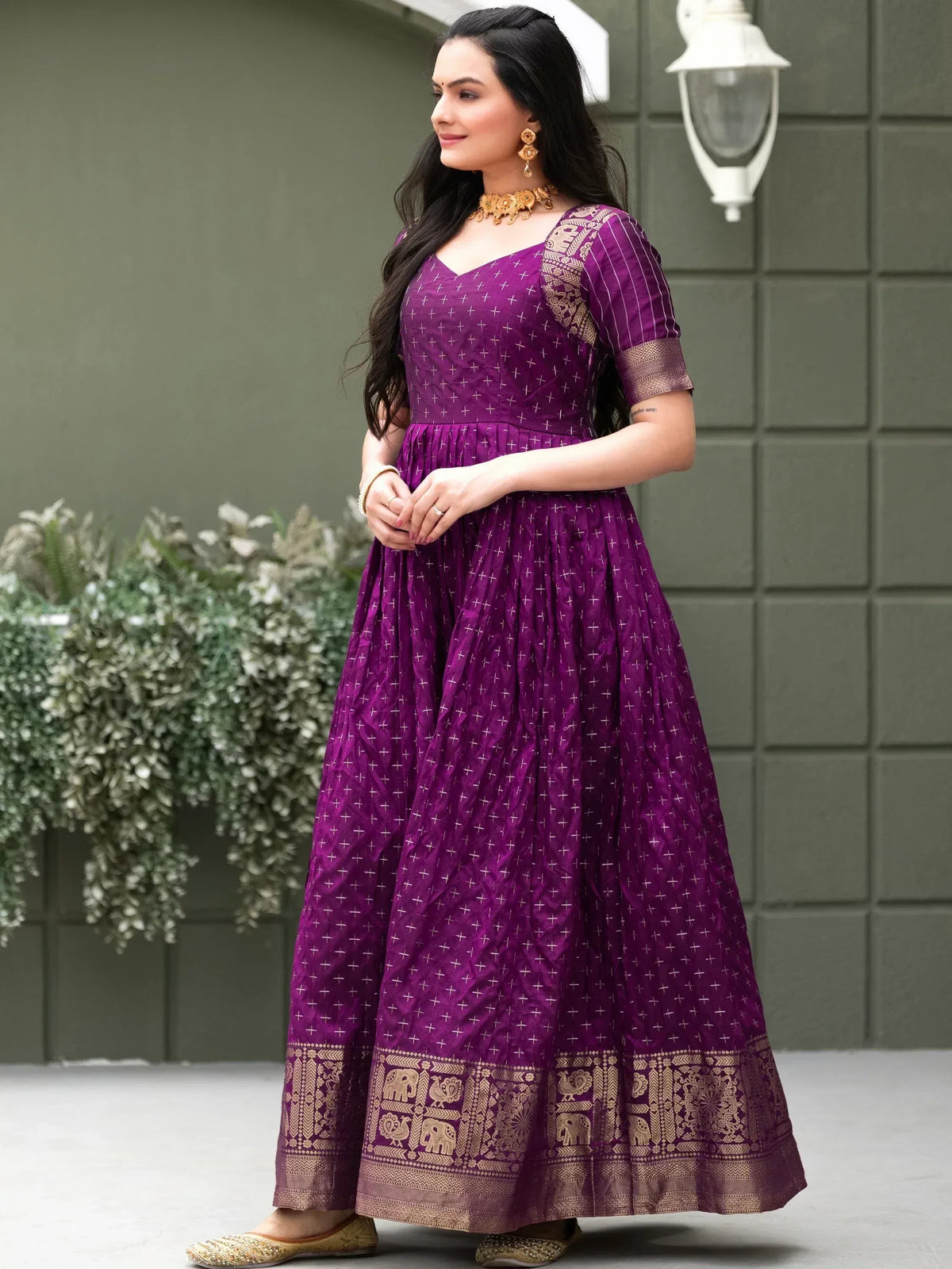 Purple ethnic gown with gold elephant border, perfect for Indian occasions and festive wear