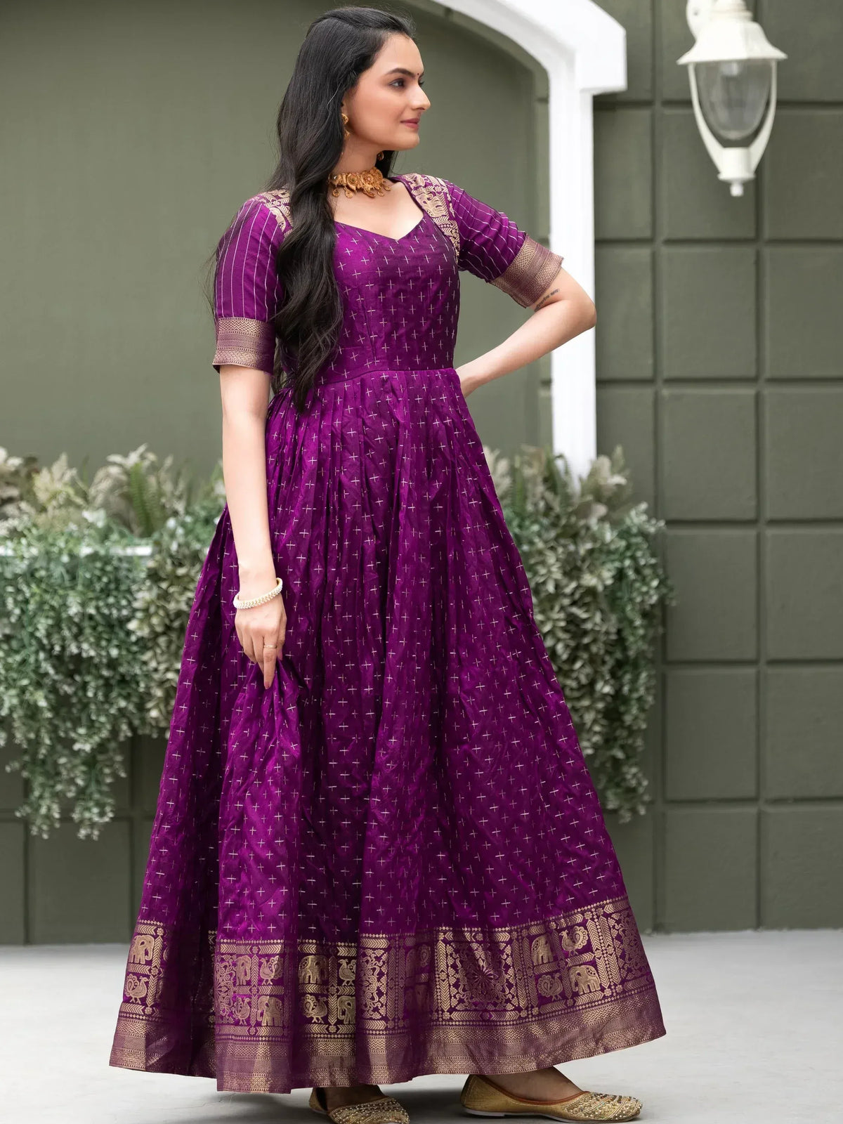 Purple ethnic gown with gold elephant border, perfect for Indian occasions and festive wear