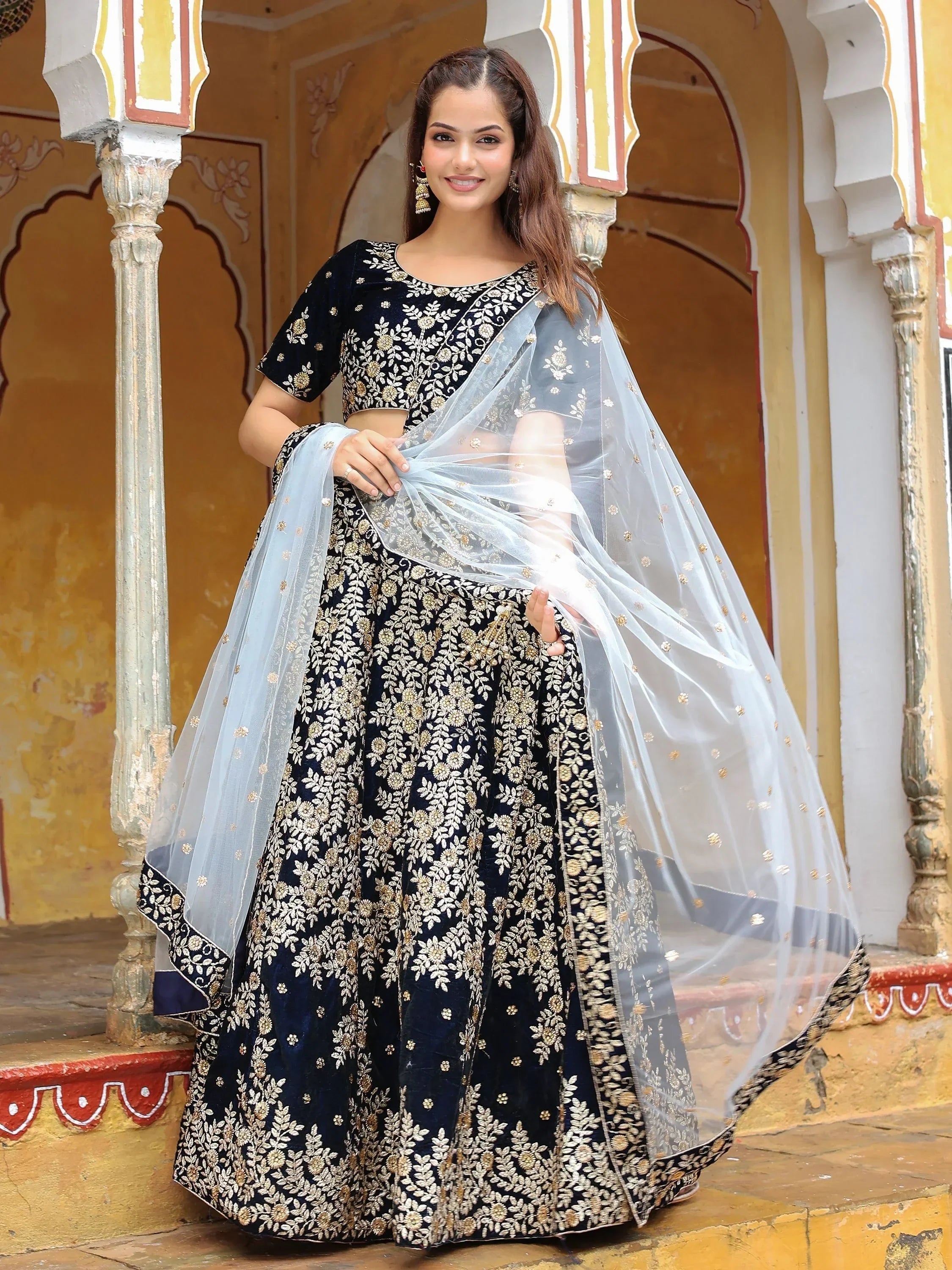 Elegant navy blue embroidered lehenga choli with sheer dupatta, perfect for Indian ethnic occasions