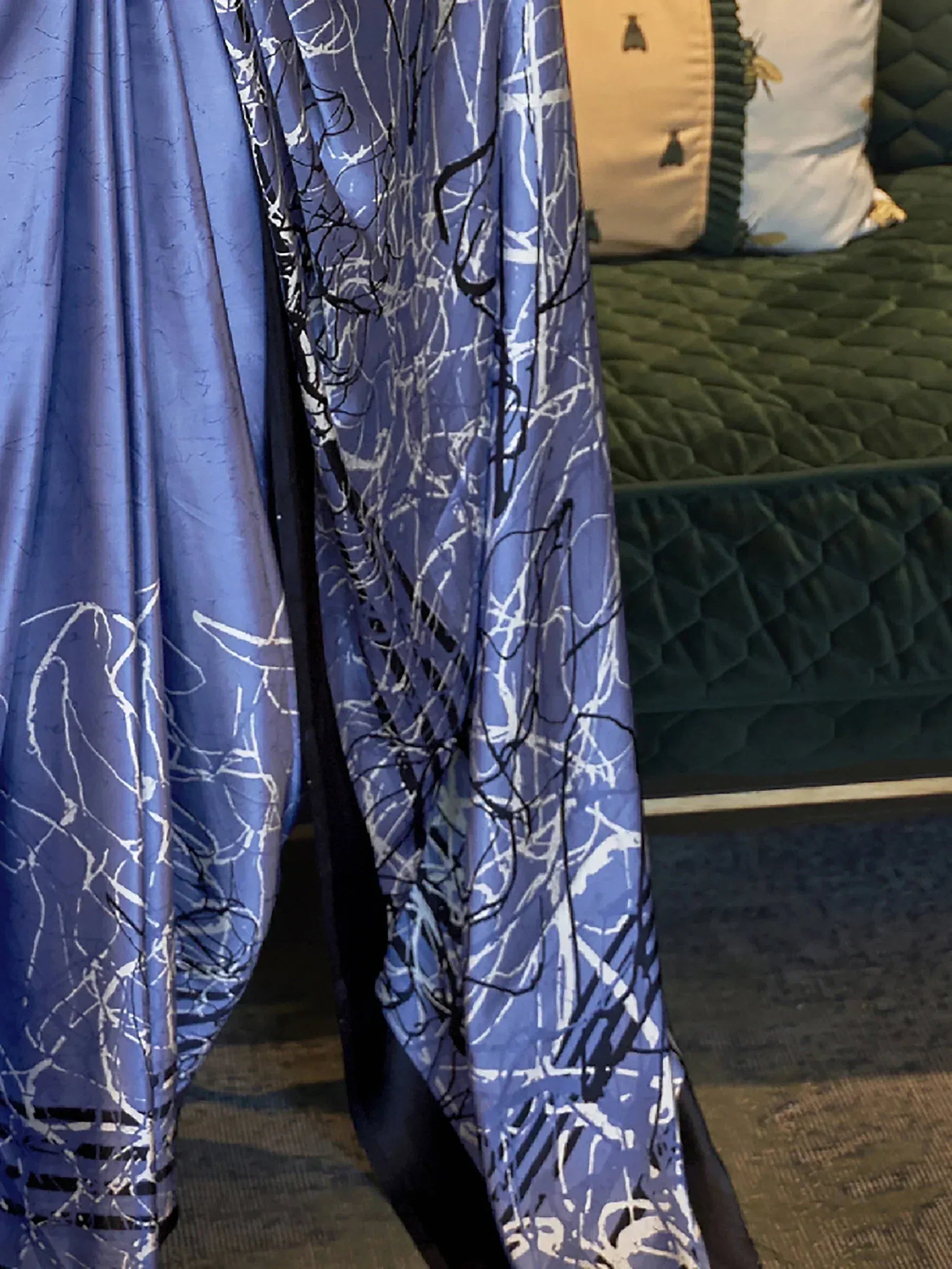 Blue printed ethnic gown with abstract white and black design, perfect for Indian occasions