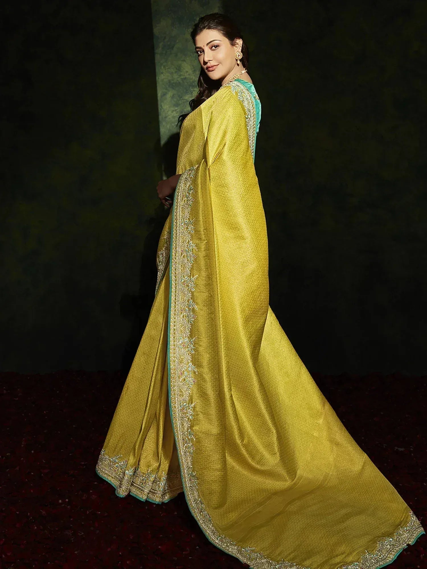 Yellow designer saree with teal blouse and gold embroidery, elegant Indian ethnic wear