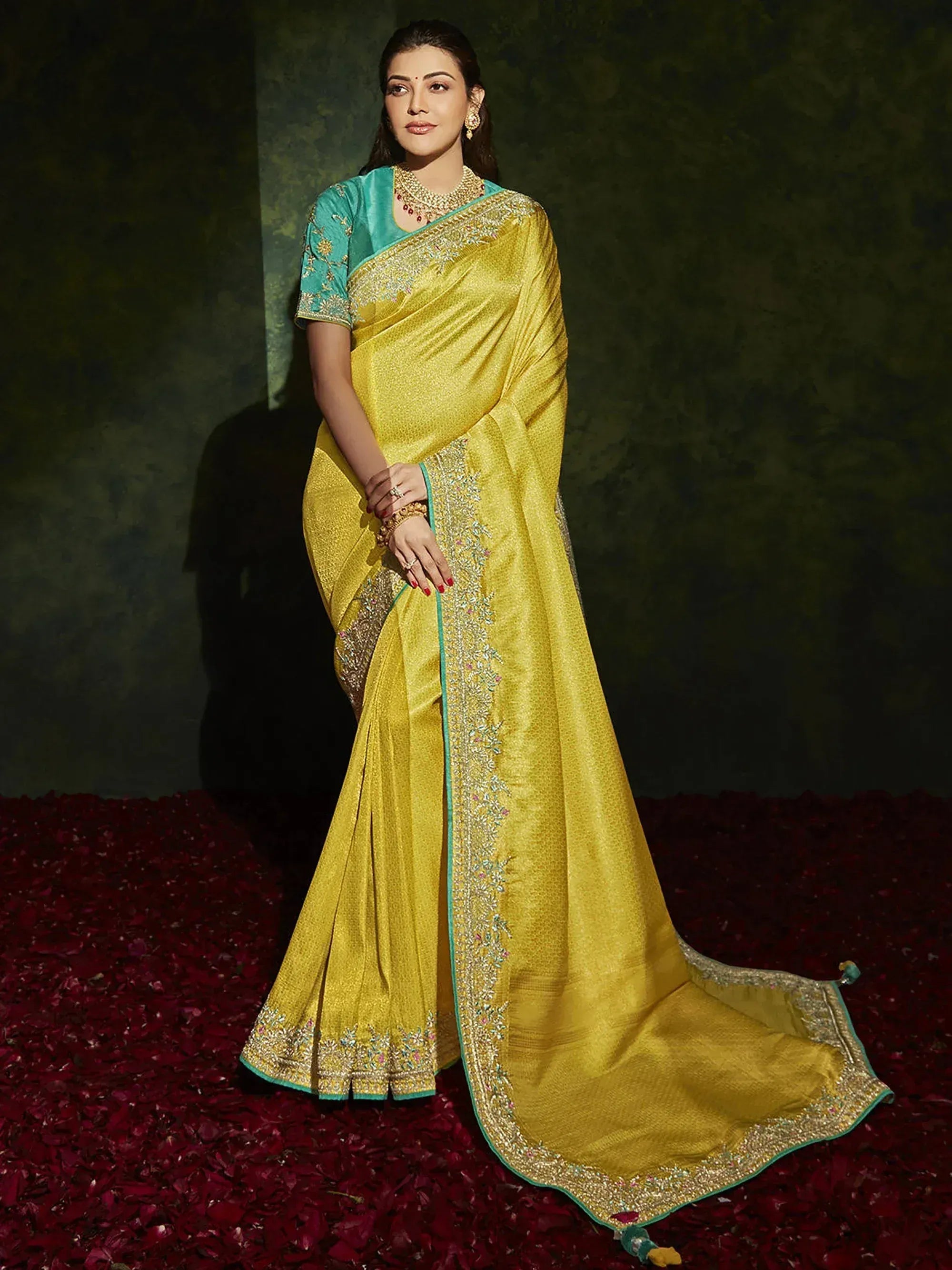 Yellow designer saree with teal blouse, intricate embroidery, perfect for Indian ethnic occasions