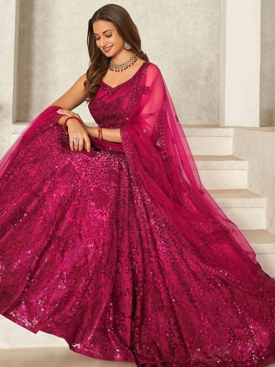 Fuchsia sequin lehenga choli with sheer dupatta, perfect for Indian weddings and festive occasions