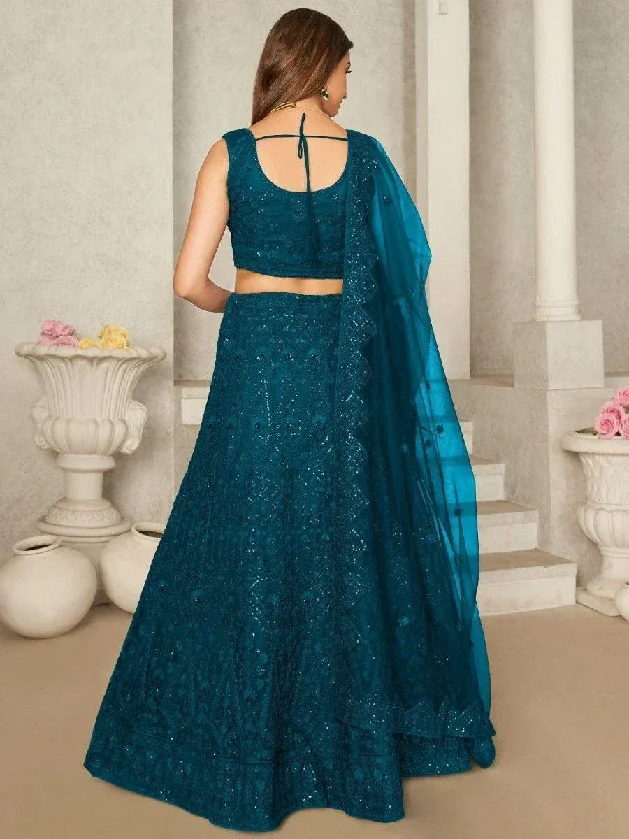 Teal blue embroidered lehenga choli with back tie blouse and sheer dupatta, perfect for Indian ethnic wear occasions