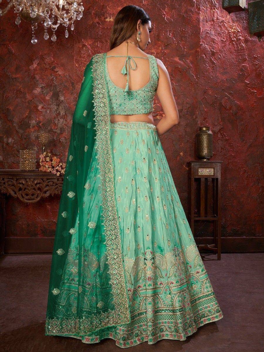 Mint green designer lehenga choli with gold embroidery and matching dupatta, elegant ethnic wear for weddings