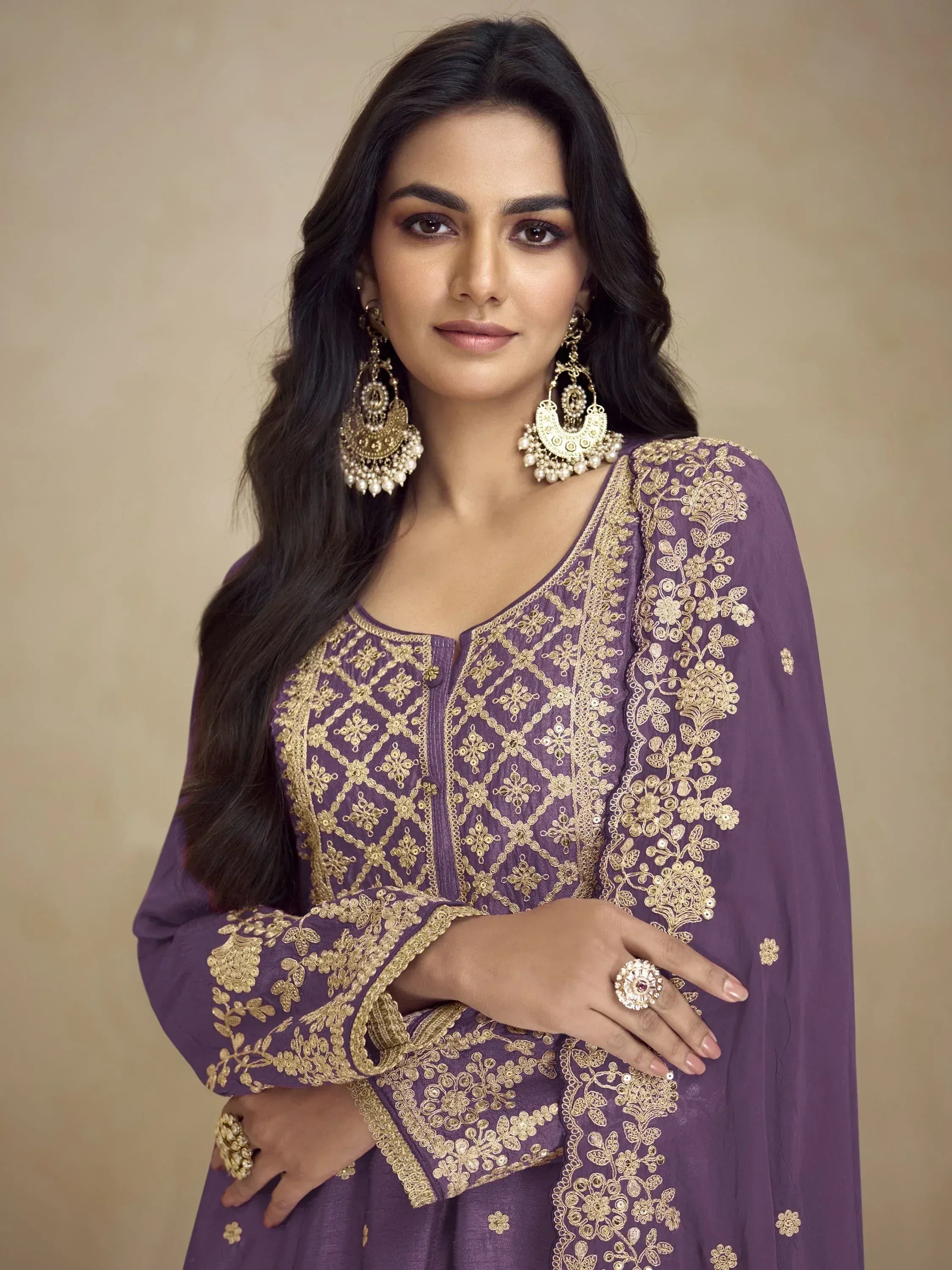Purple ethnic gown with gold embroidery, perfect for Indian occasions and weddings