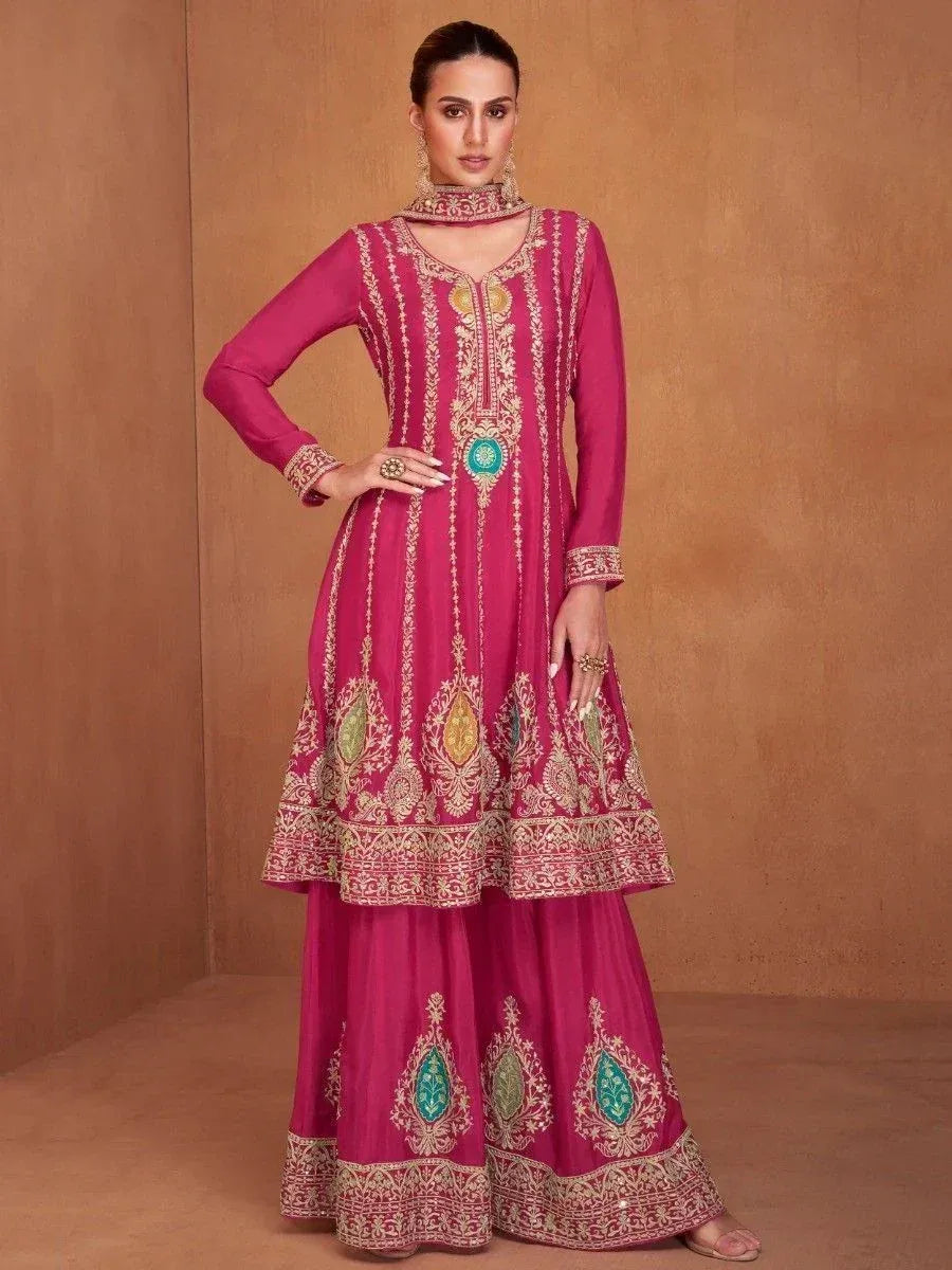 Pink embroidered anarkali suit with gold and teal detailing, perfect for Indian ethnic occasions