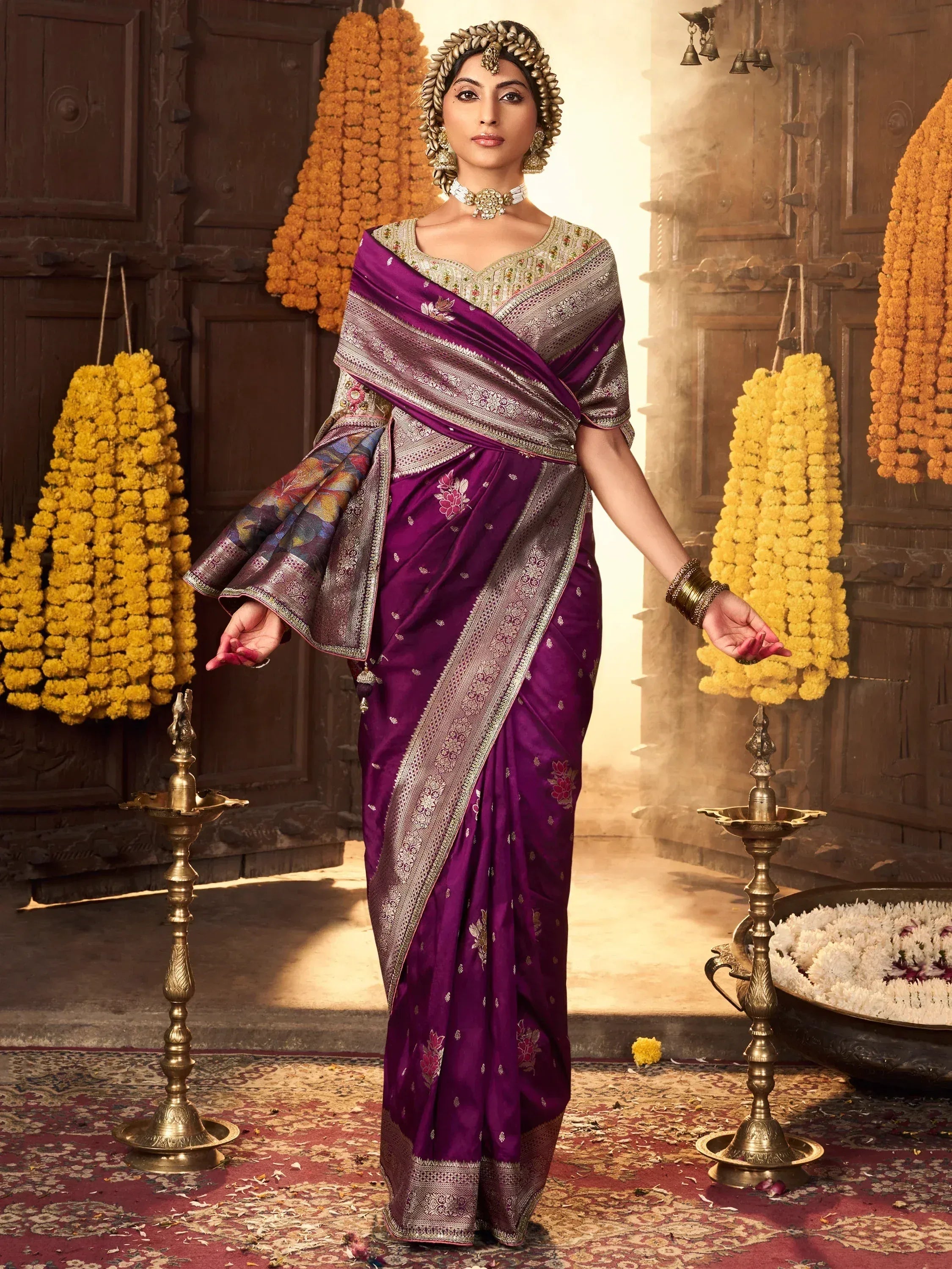 Woman in purple designer saree with gold embroidery, traditional Indian ethnic wear for festive occasions