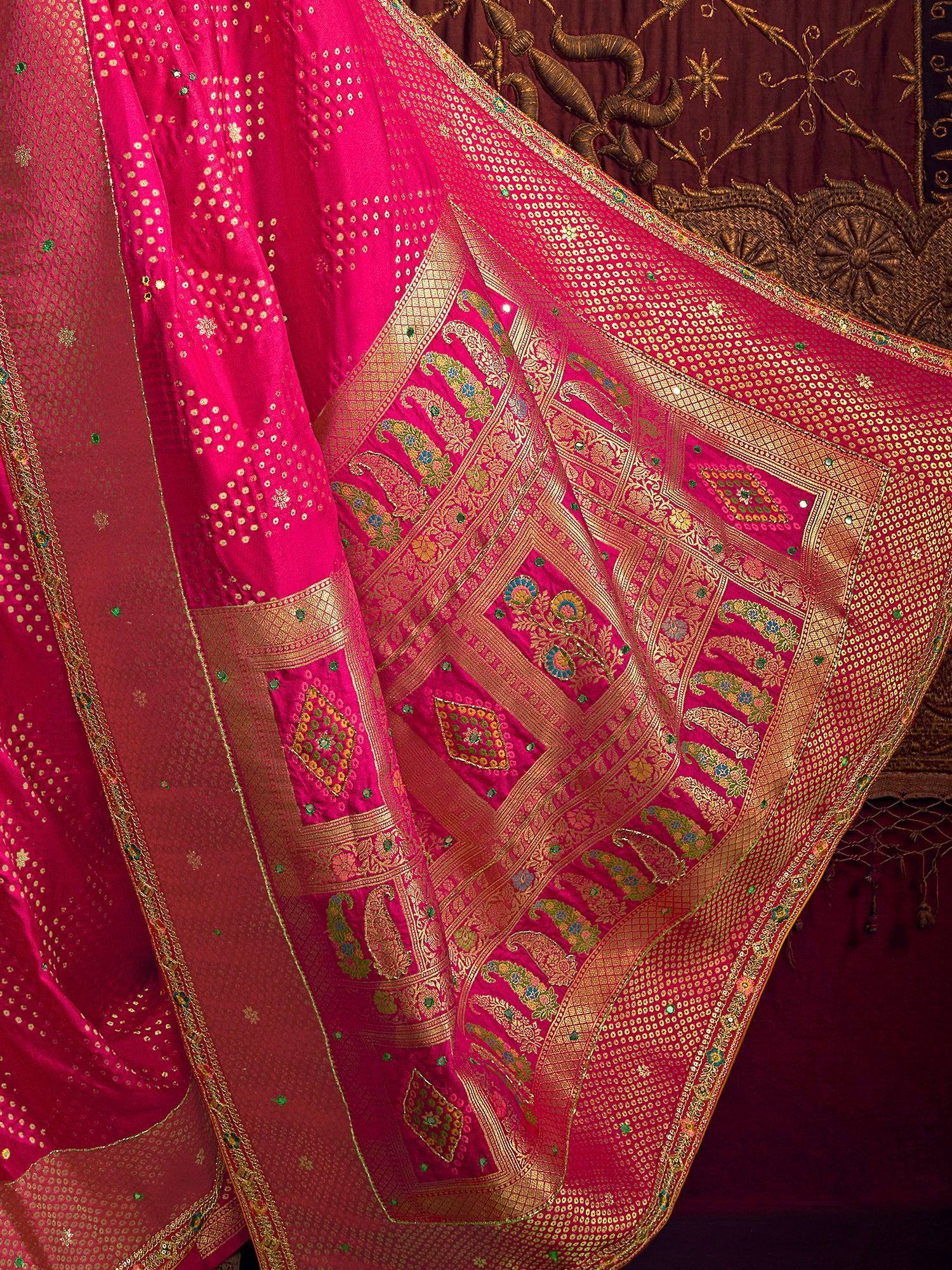 Fuchsia designer saree with gold paisley embroidery and sequin work, perfect for Indian ethnic wear occasions.