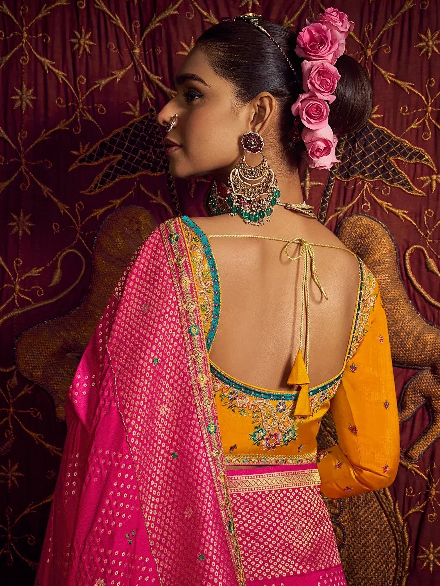Yellow and pink embroidered lehenga choli with floral dupatta, traditional Indian ethnic wear for women