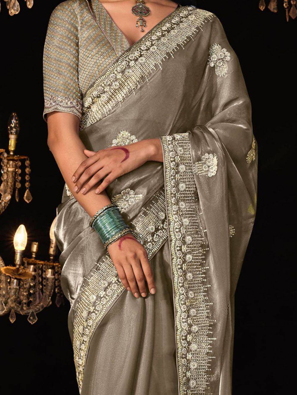Elegant grey saree with intricate silver embroidery and matching blouse, perfect for Indian ethnic occasions.