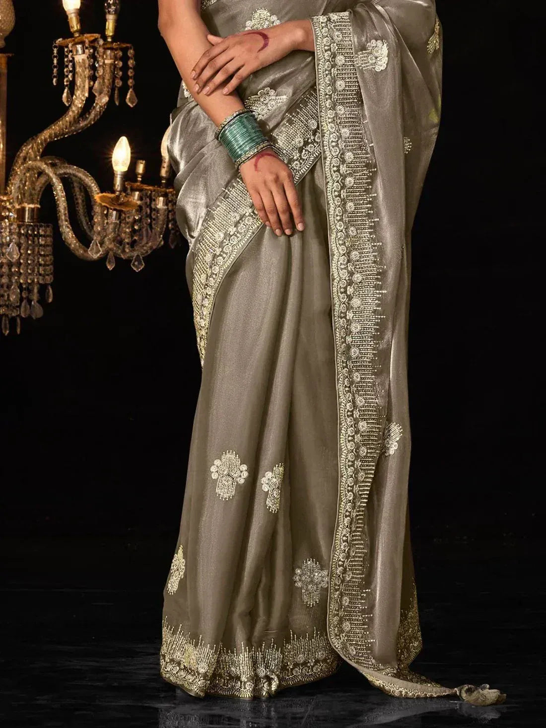 Elegant grey saree with gold embroidery and sequin work, perfect for Indian ethnic occasions