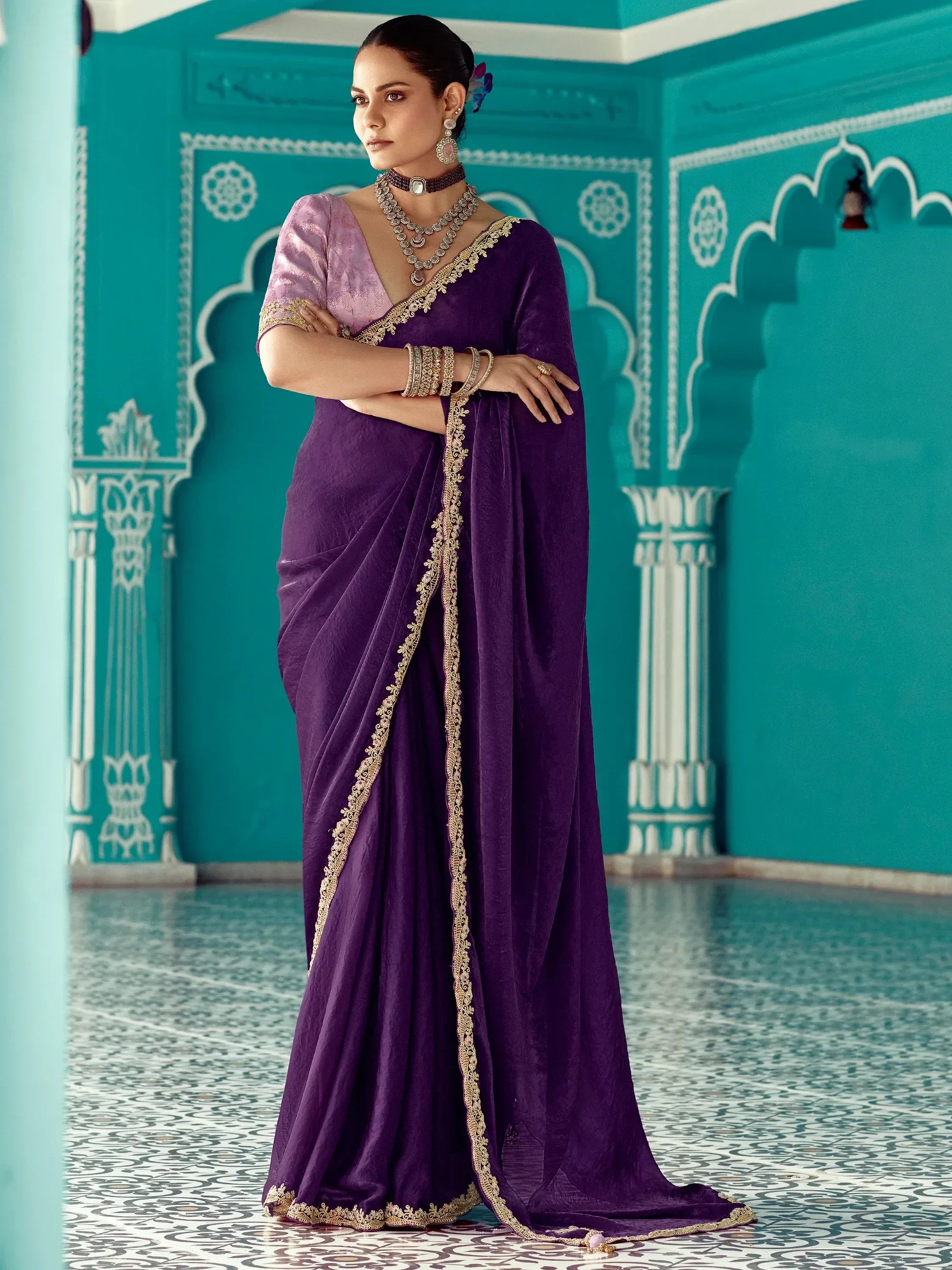 Purple velvet saree with gold embroidery, paired with pink blouse, perfect for Indian ethnic occasions.