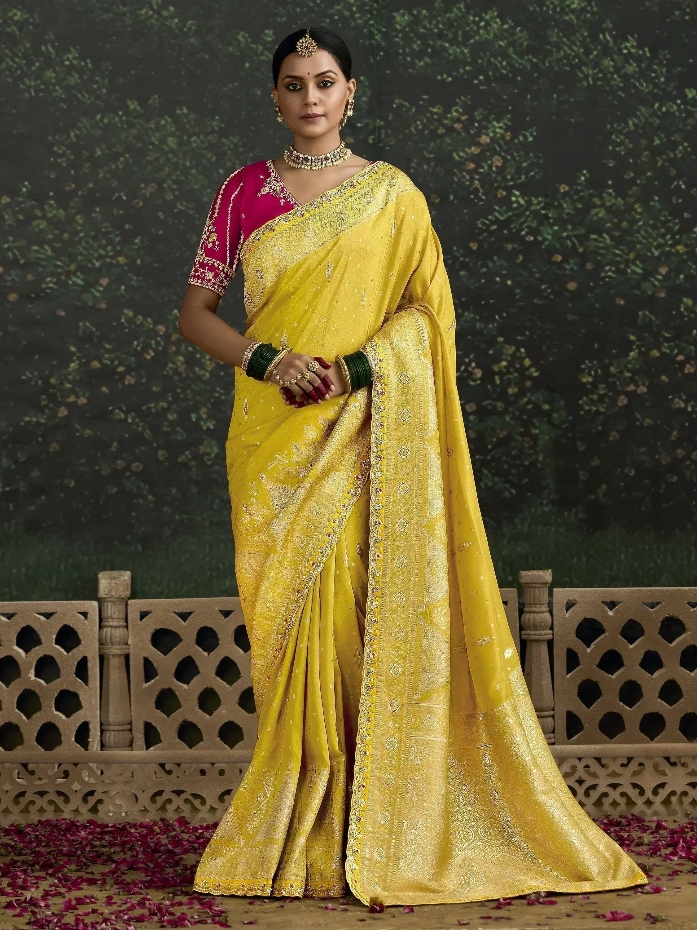 Yellow designer saree with gold embroidery and pink blouse, perfect for Indian ethnic occasions