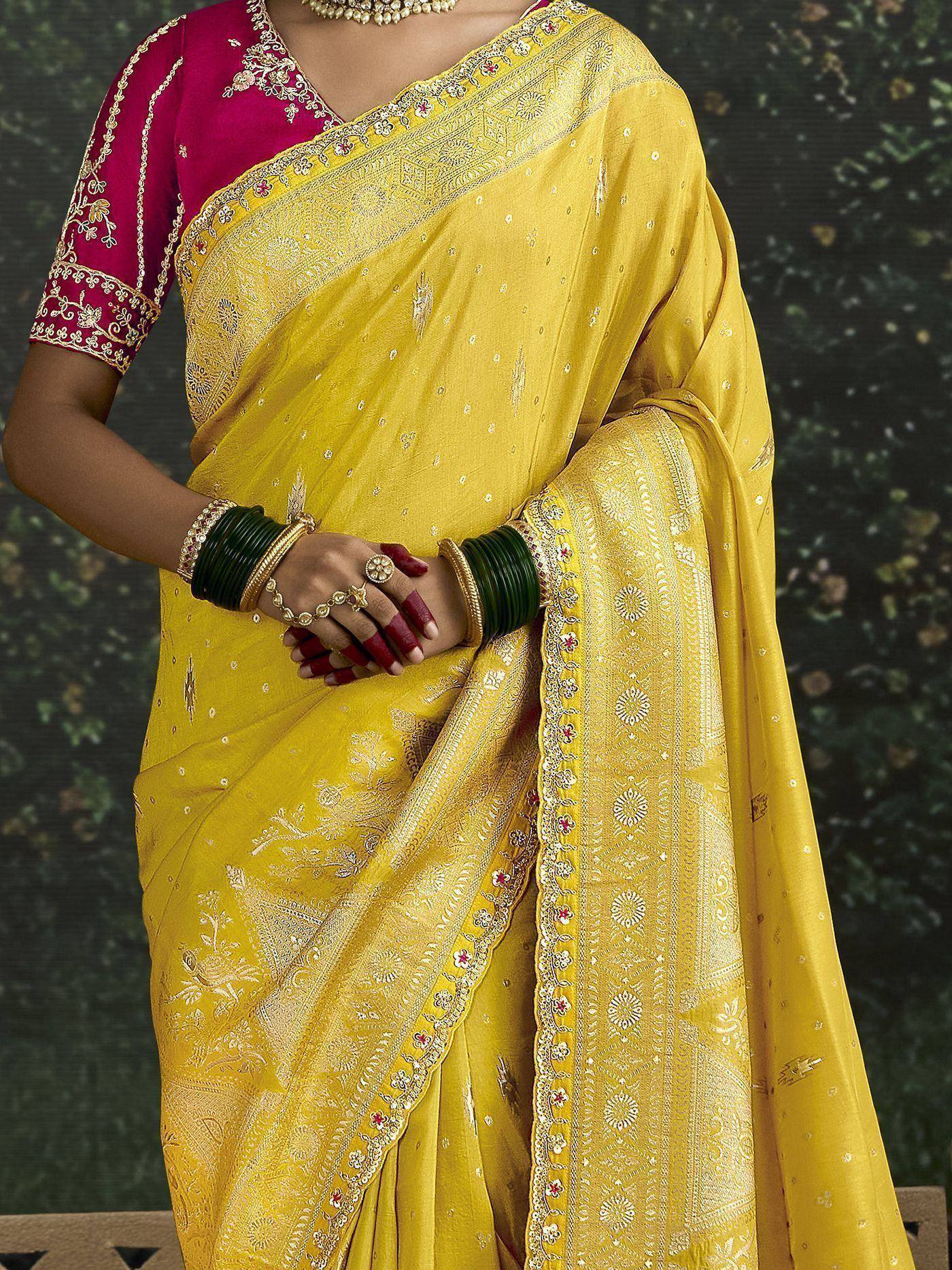 Yellow embroidered saree with pink blouse, traditional Indian ethnic wear for women