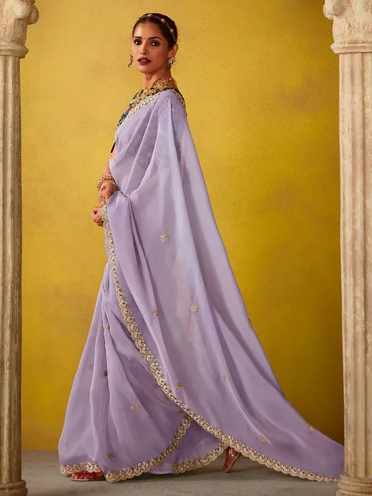 Lavender designer saree with gold embroidery, perfect for Indian ethnic occasions and weddings