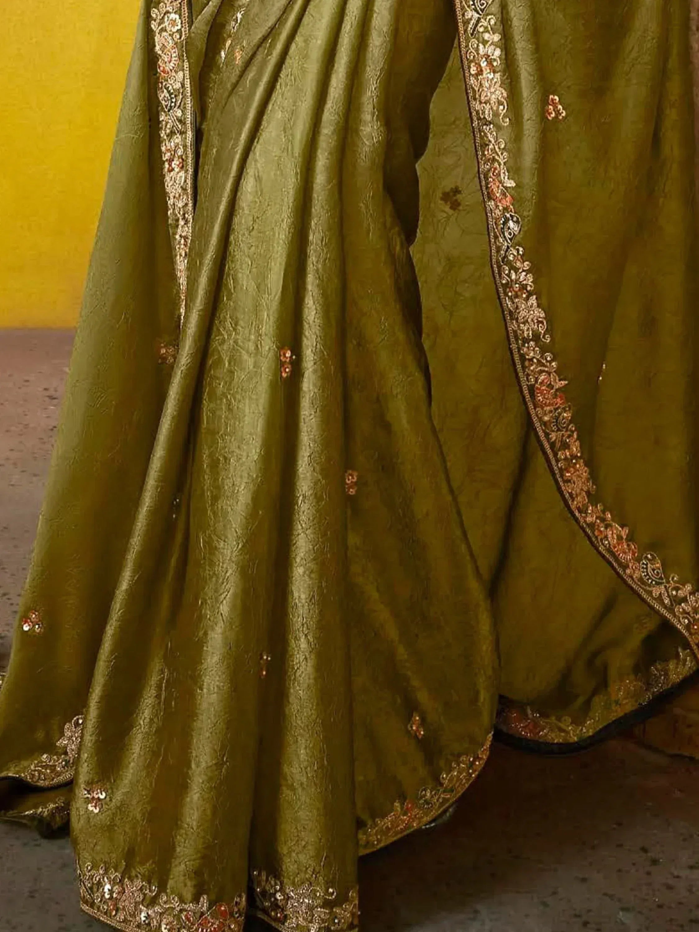 Olive green designer lehenga with intricate gold and floral embroidery, perfect for Indian ethnic wear.