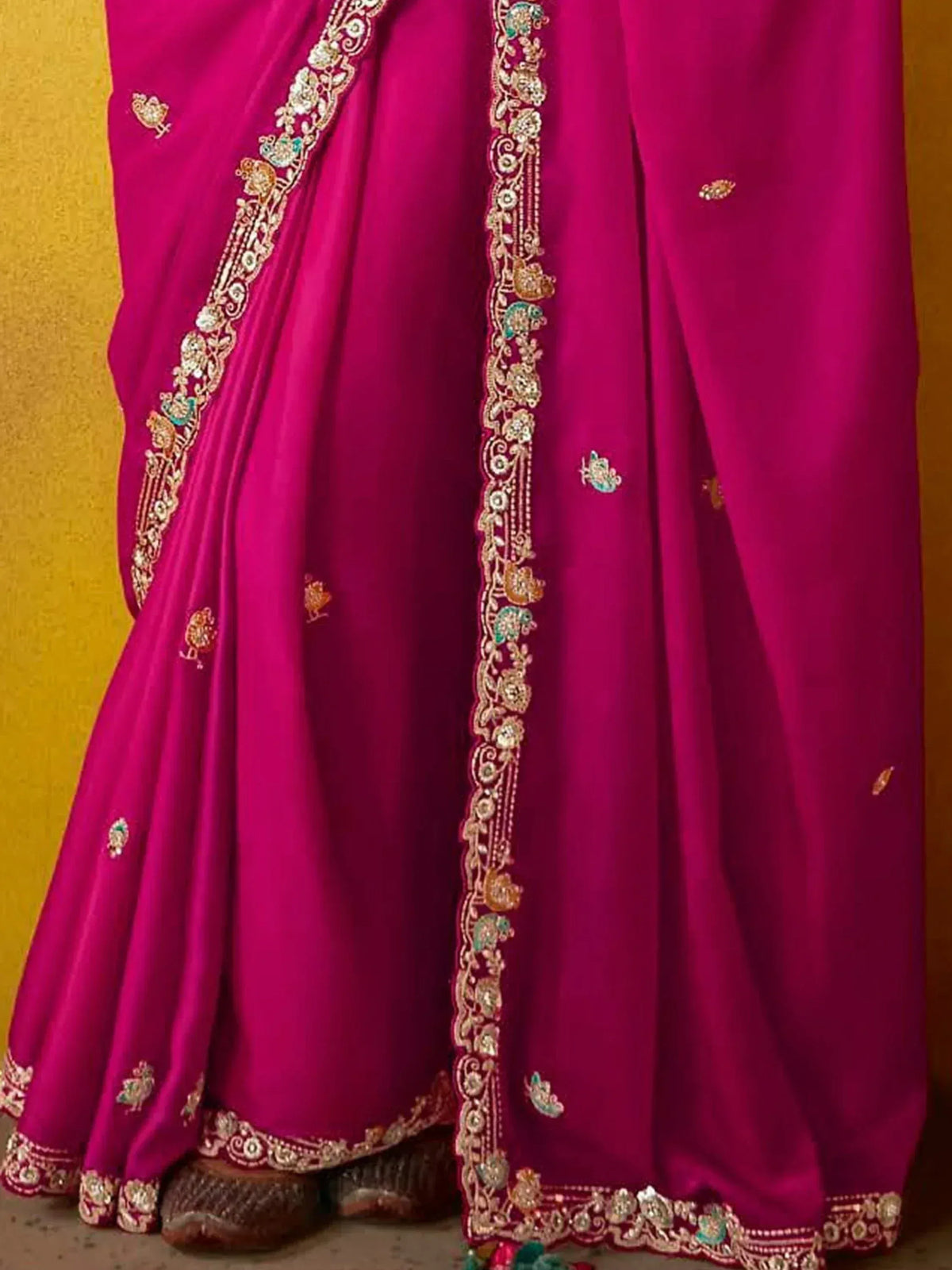 Fuchsia Indian saree with gold and peacock embroidery, perfect for ethnic wear occasions