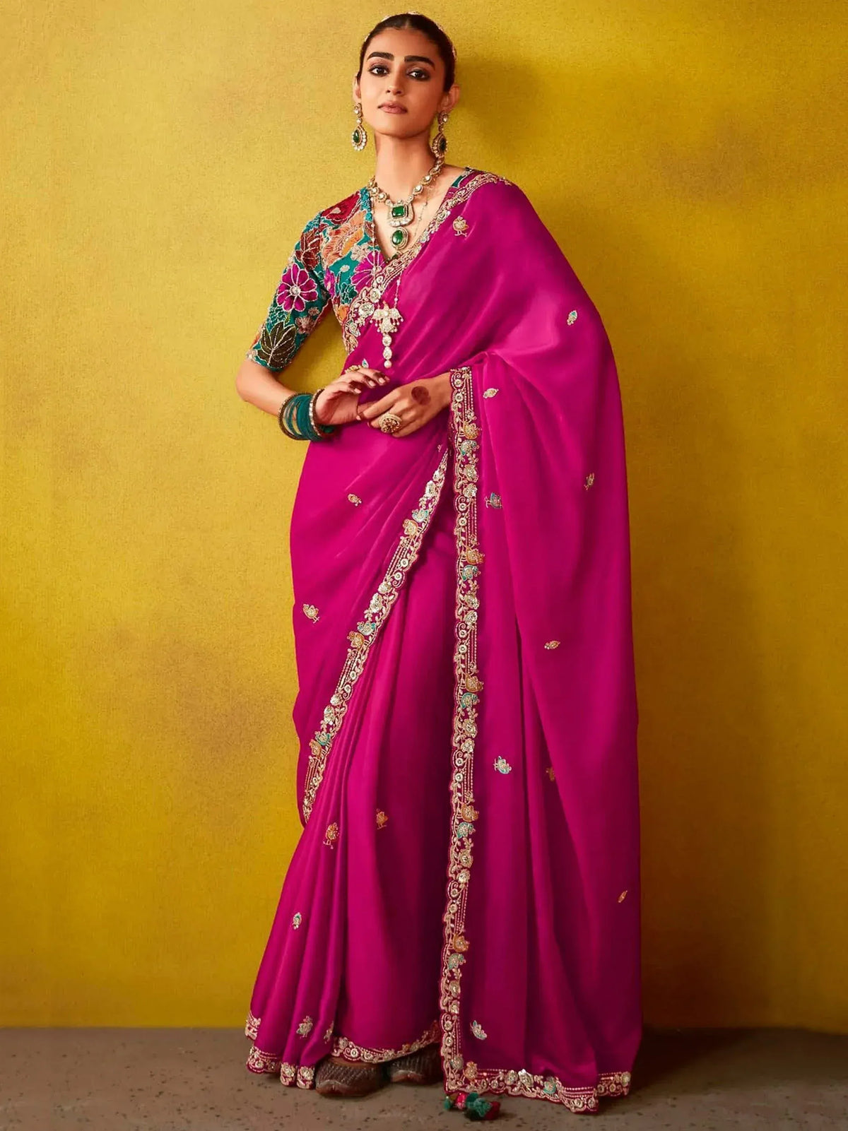 Fuchsia designer saree with floral blouse and gold embroidery, perfect for Indian ethnic wear occasions