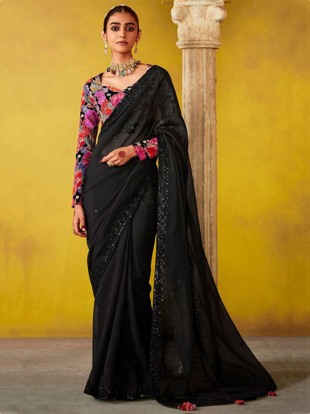 Black saree with floral embroidered blouse, perfect for Indian ethnic wear occasions
