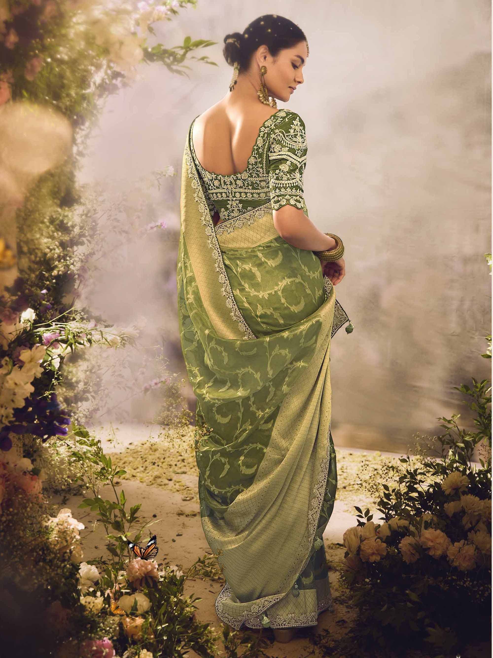 Elegant green embroidered saree with gold detailing, perfect for Indian ethnic wear and festive occasions.
