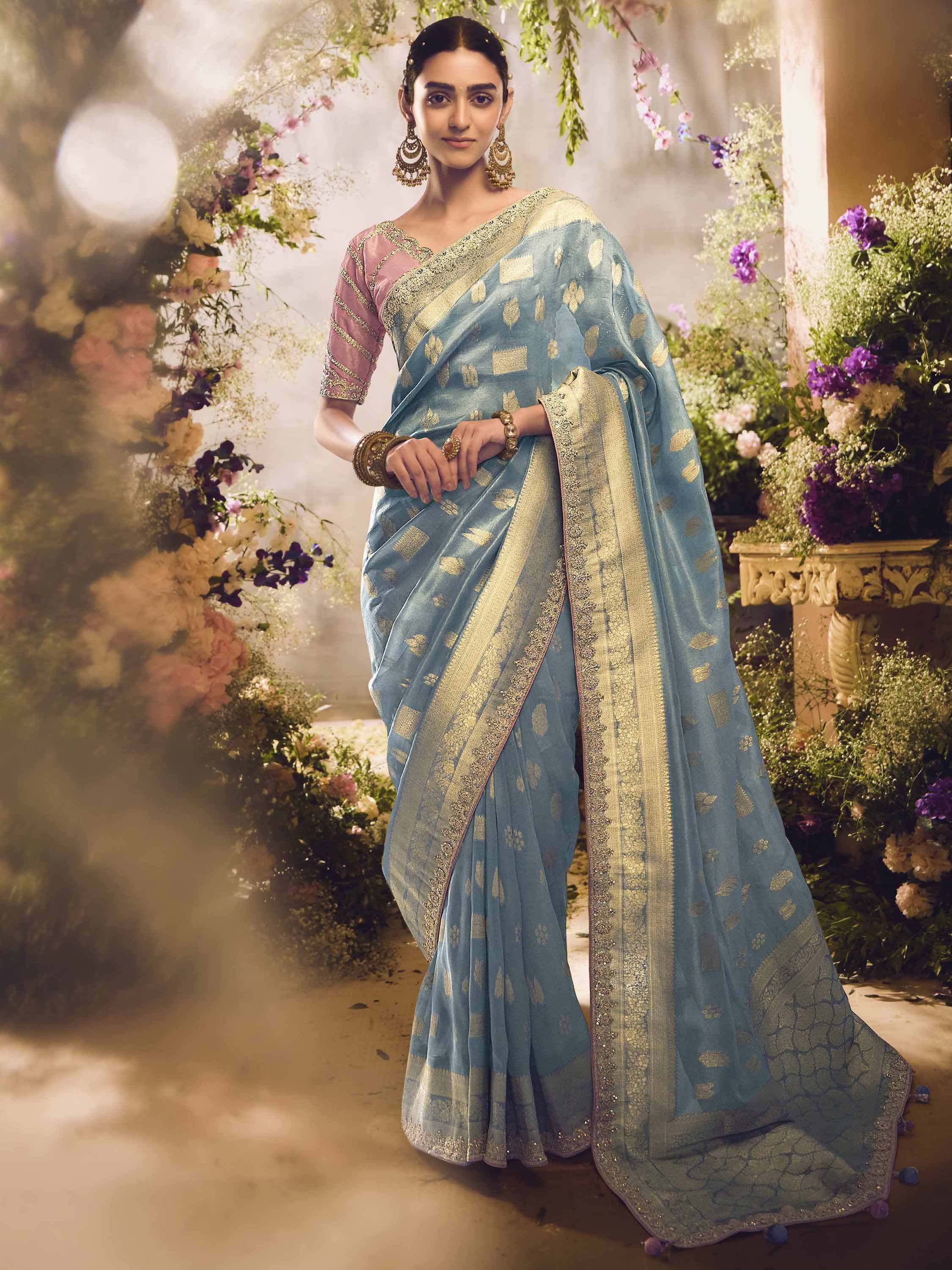 Elegant blue designer saree with gold motifs and pink blouse, perfect for Indian ethnic occasions