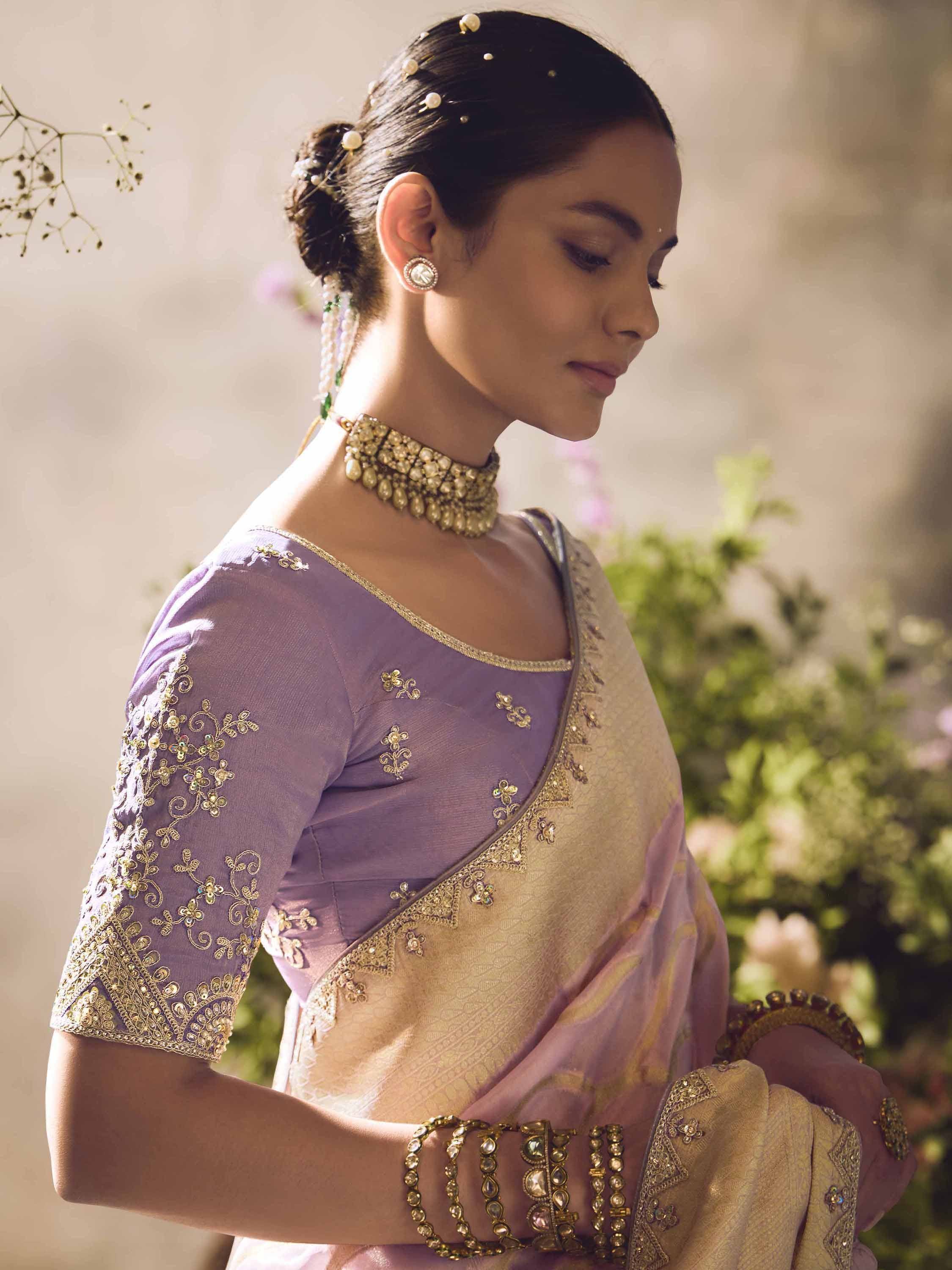 Elegant lavender saree with gold embroidery, perfect for Indian ethnic wear and festive occasions.