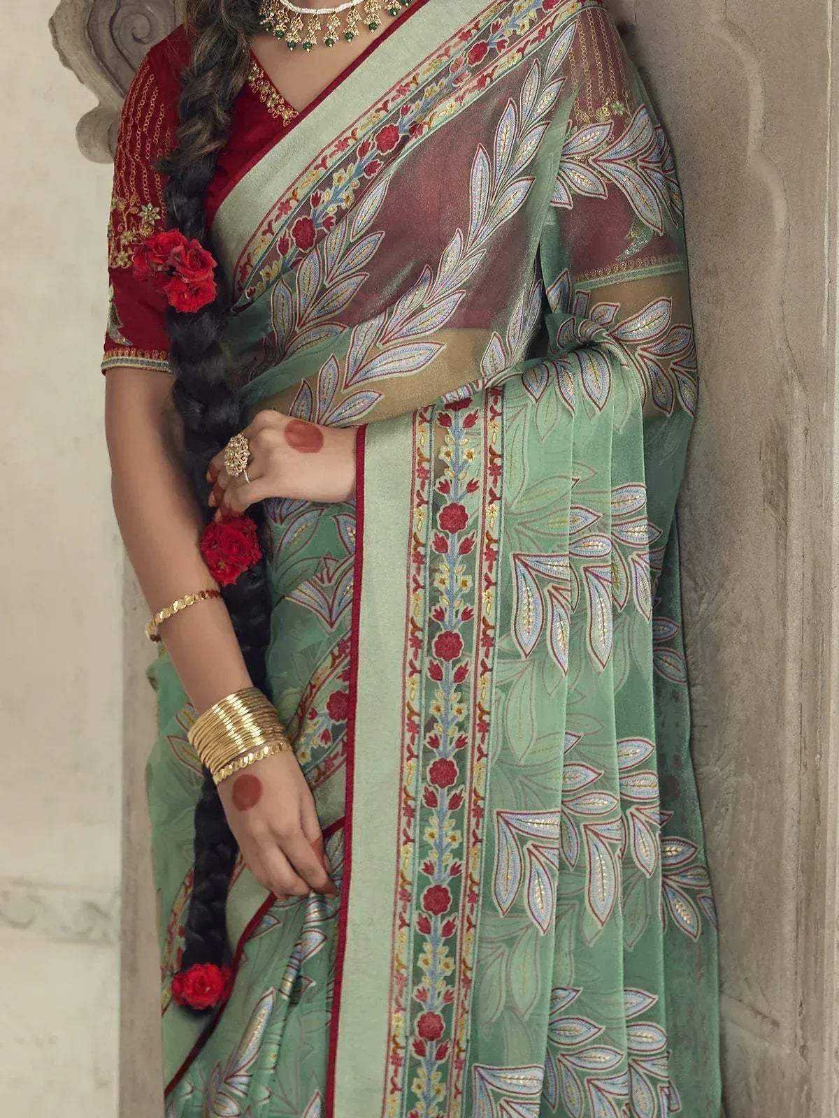 Green and red embroidered saree with floral border, traditional Indian ethnic wear