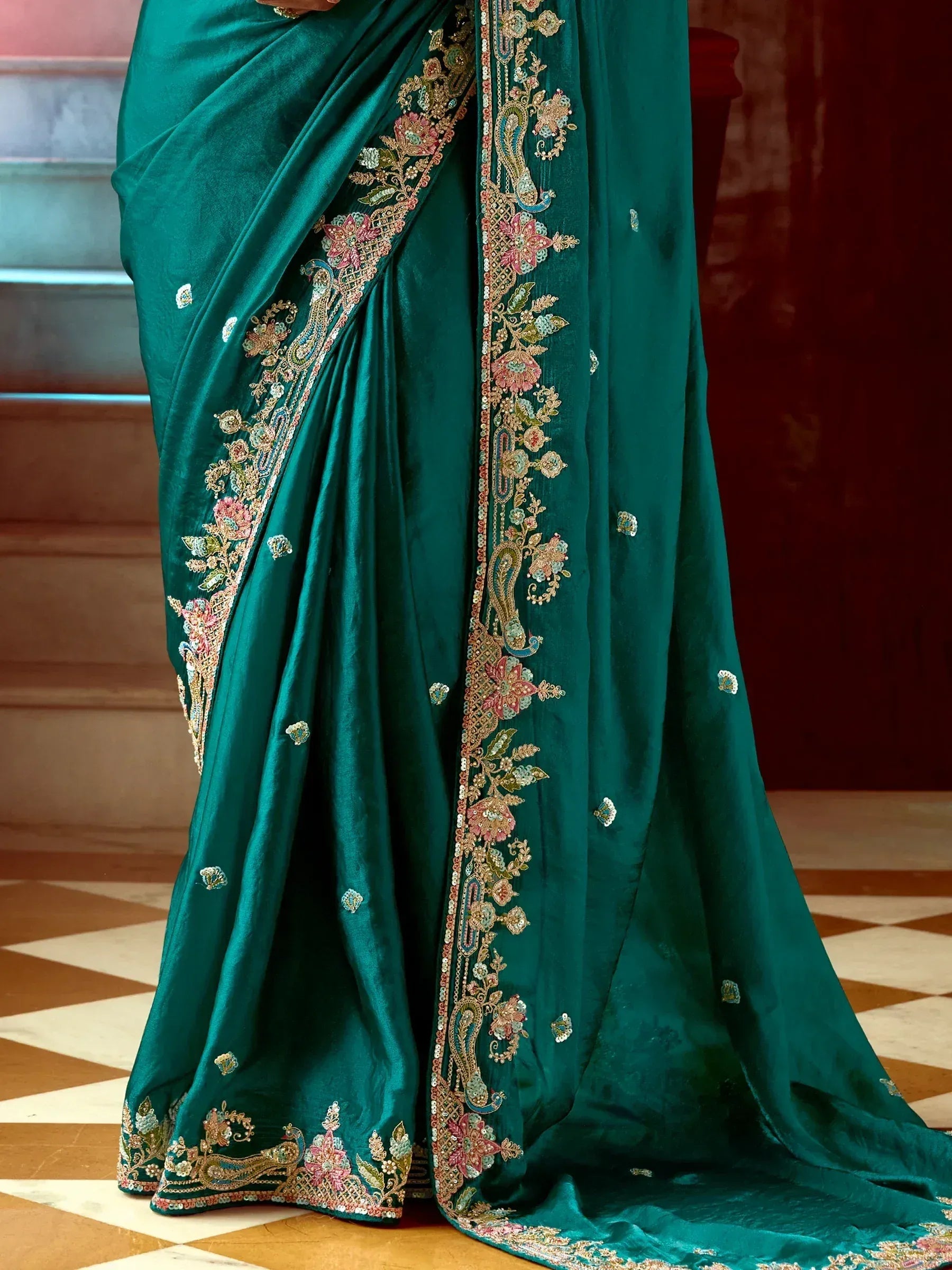 Emerald green saree with floral and paisley embroidery, perfect for Indian ethnic wear