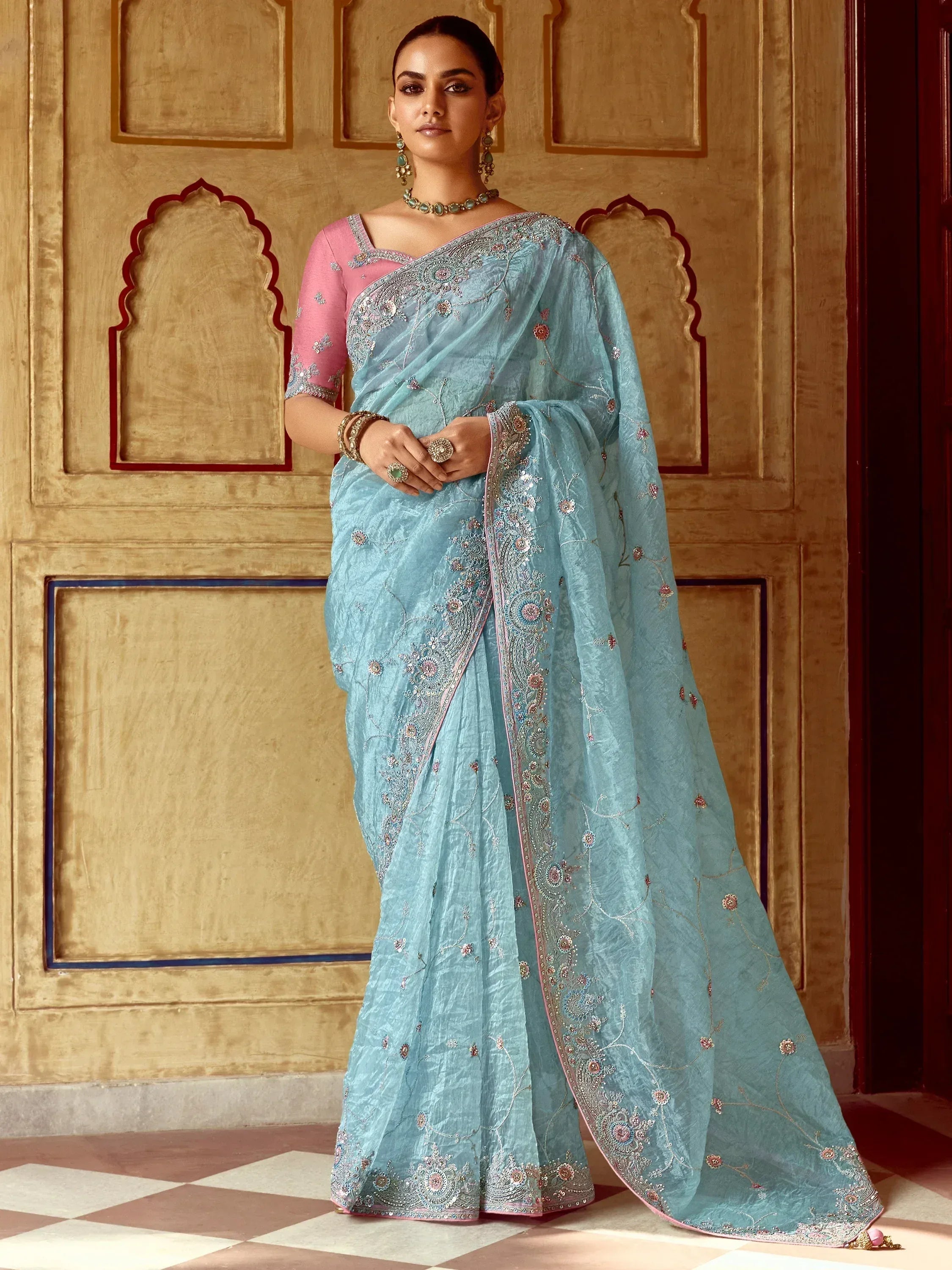 Elegant light blue saree with floral embroidery and pink blouse, perfect for Indian ethnic wear