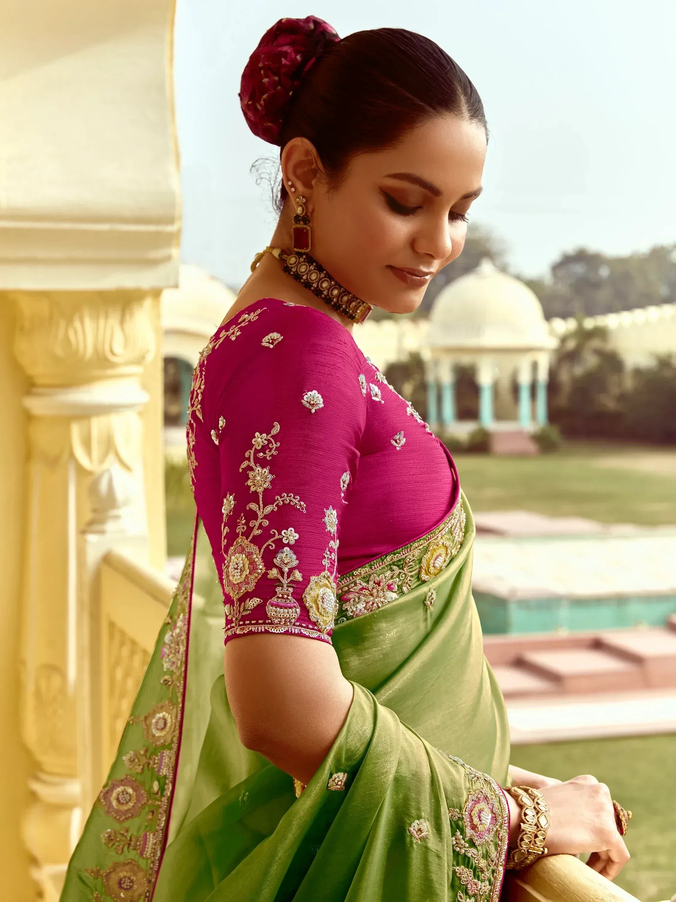 Elegant green saree with pink embroidered blouse, perfect for Indian ethnic occasions