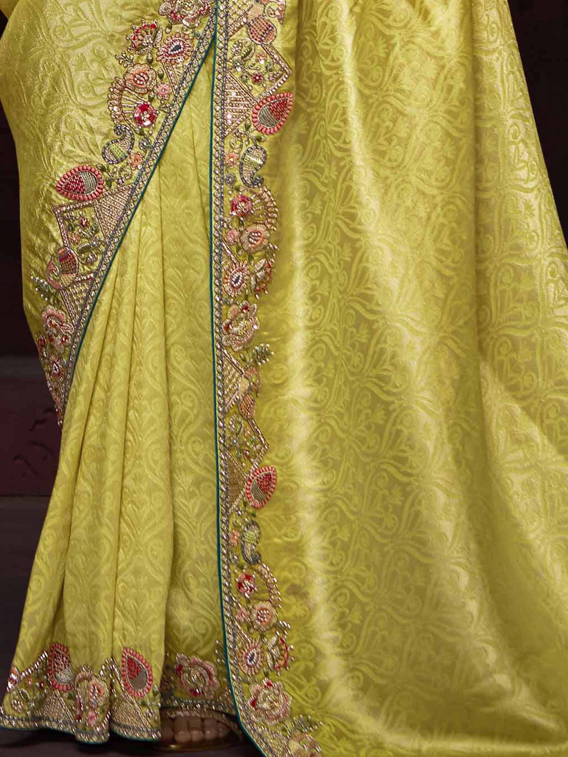 Lime green designer lehenga with intricate floral embroidery and paisley detailing for Indian ethnic wear