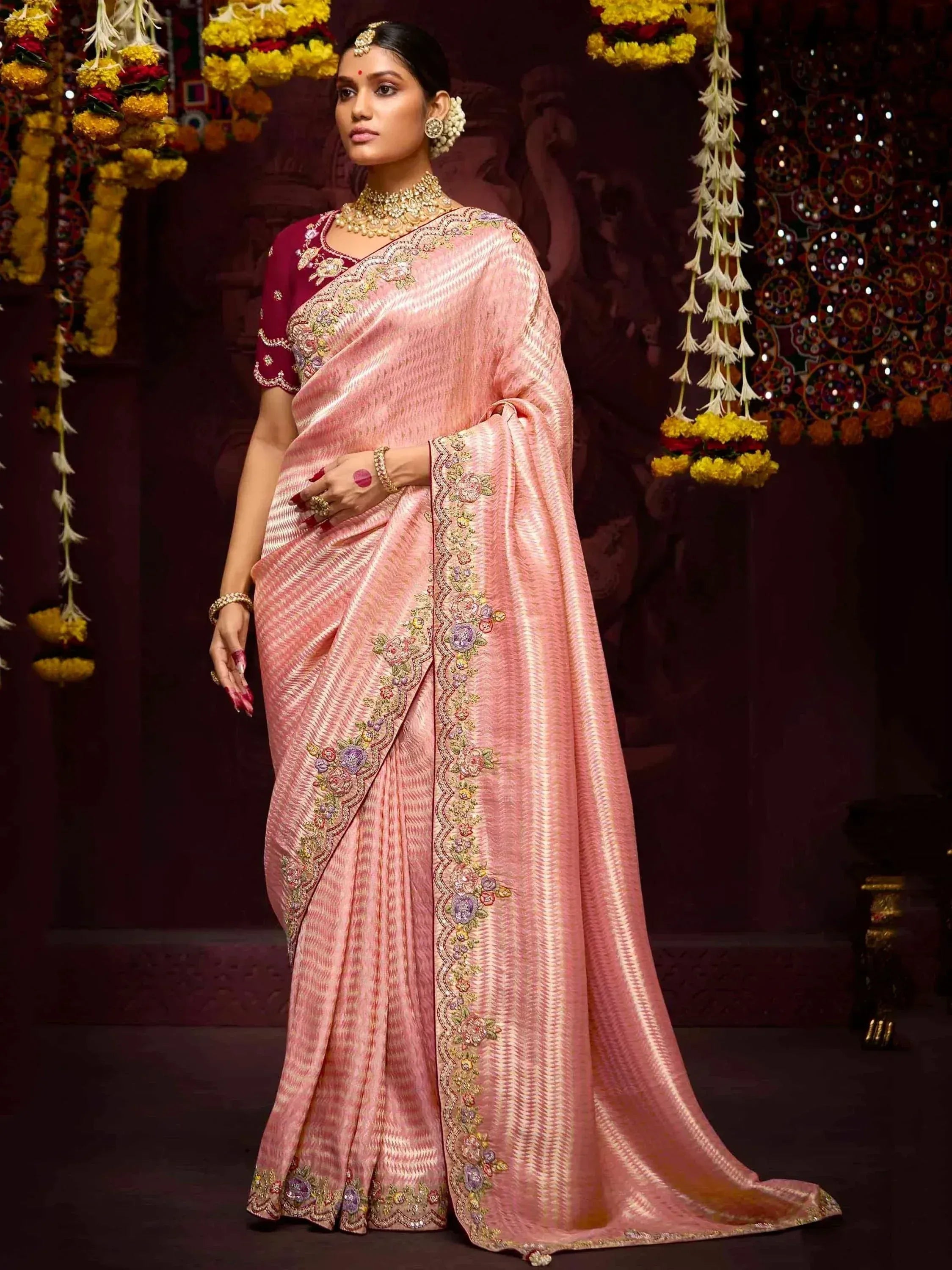 Pink embroidered saree with floral border, maroon blouse, perfect for Indian ethnic occasions