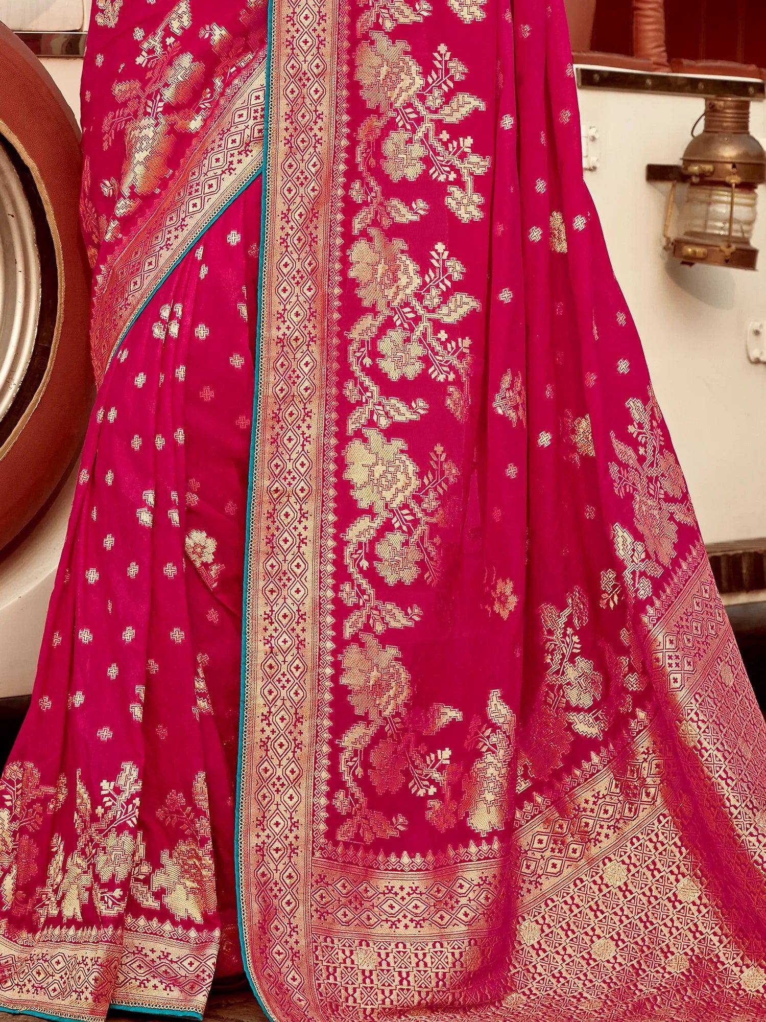 Pink silk saree with gold floral zari work and teal border, traditional Indian ethnic wear