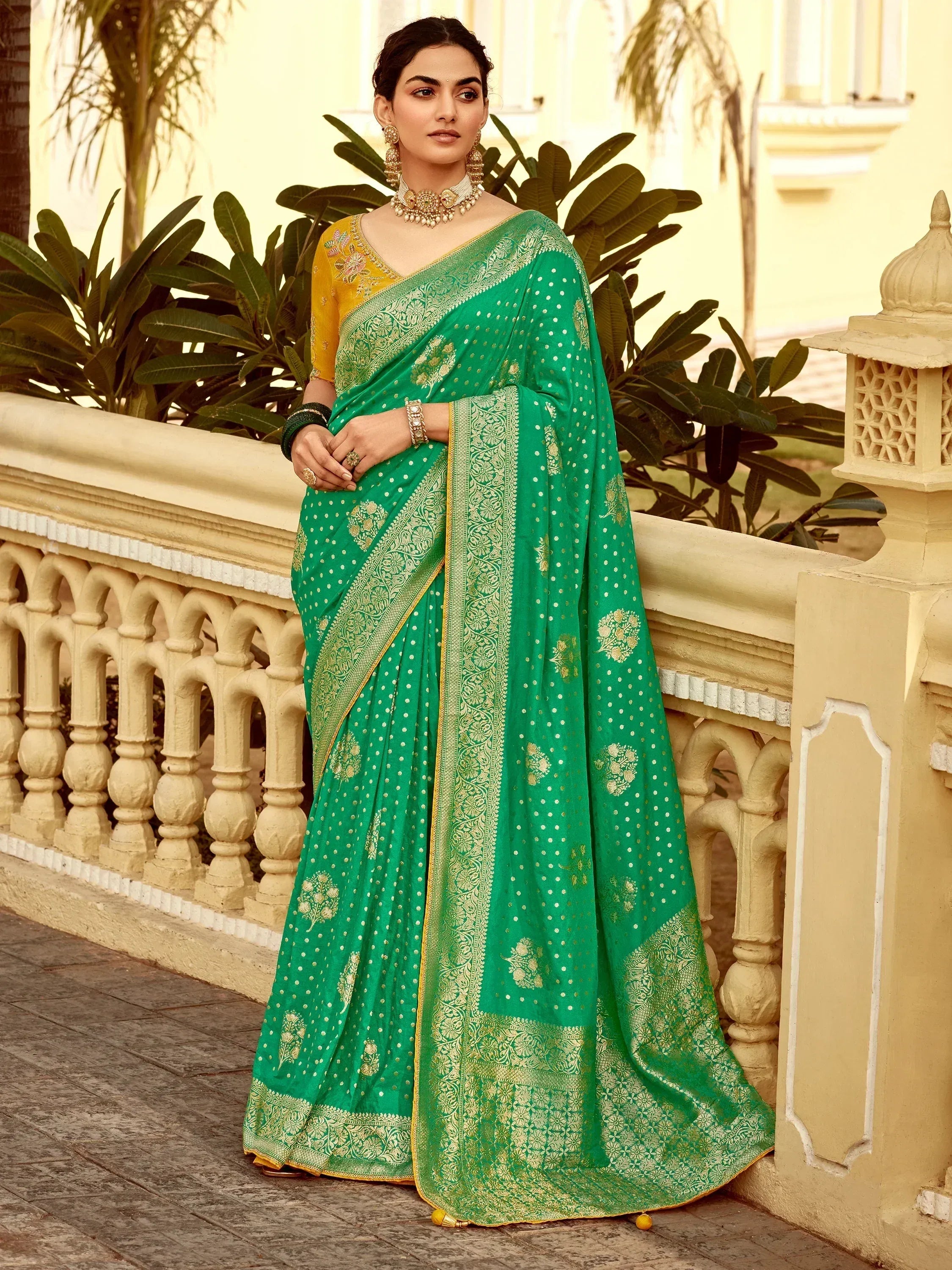 Emerald green saree with gold embroidery and yellow blouse, perfect for Indian ethnic wear