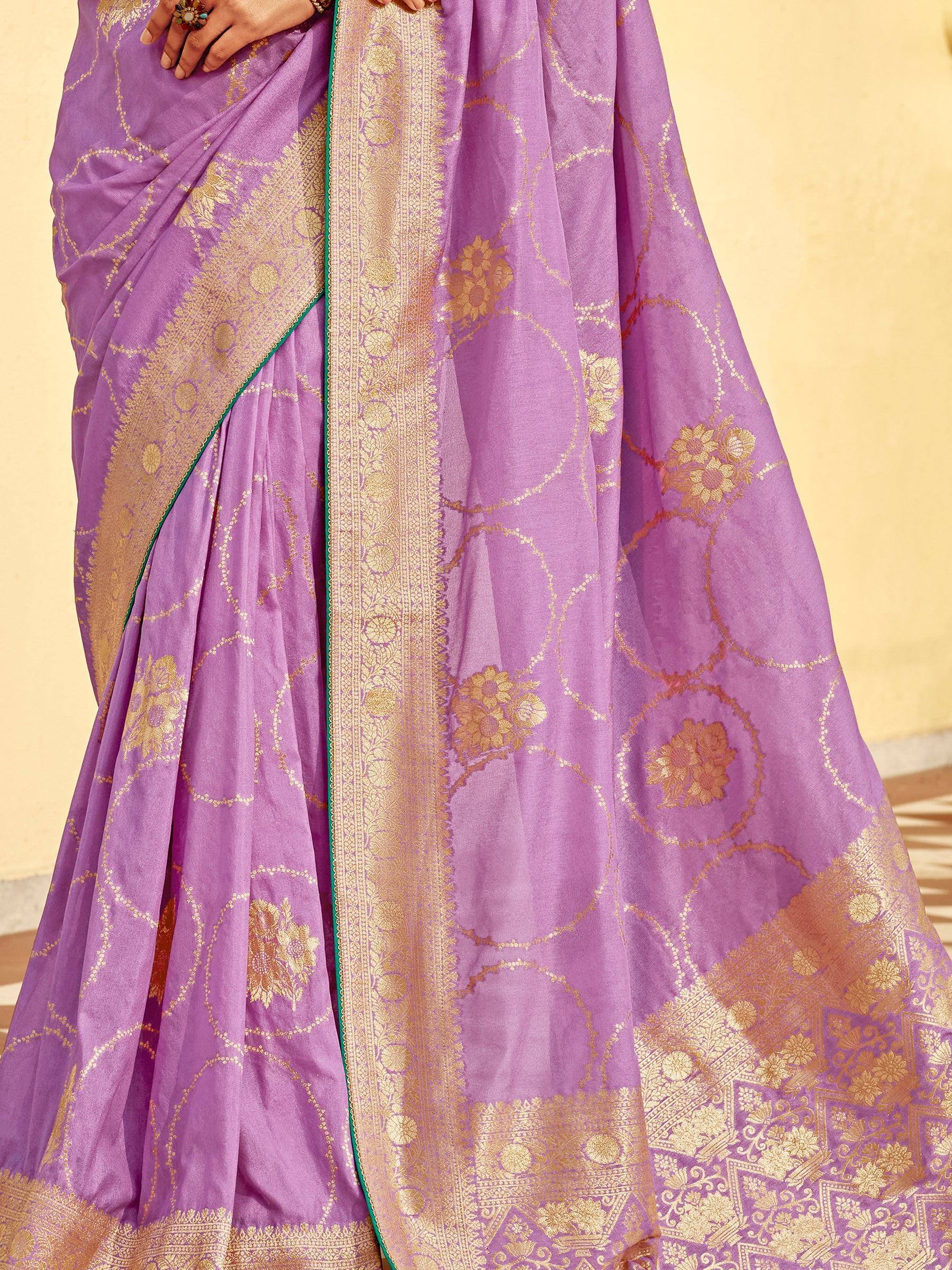 Purple saree with gold floral motifs and intricate border design