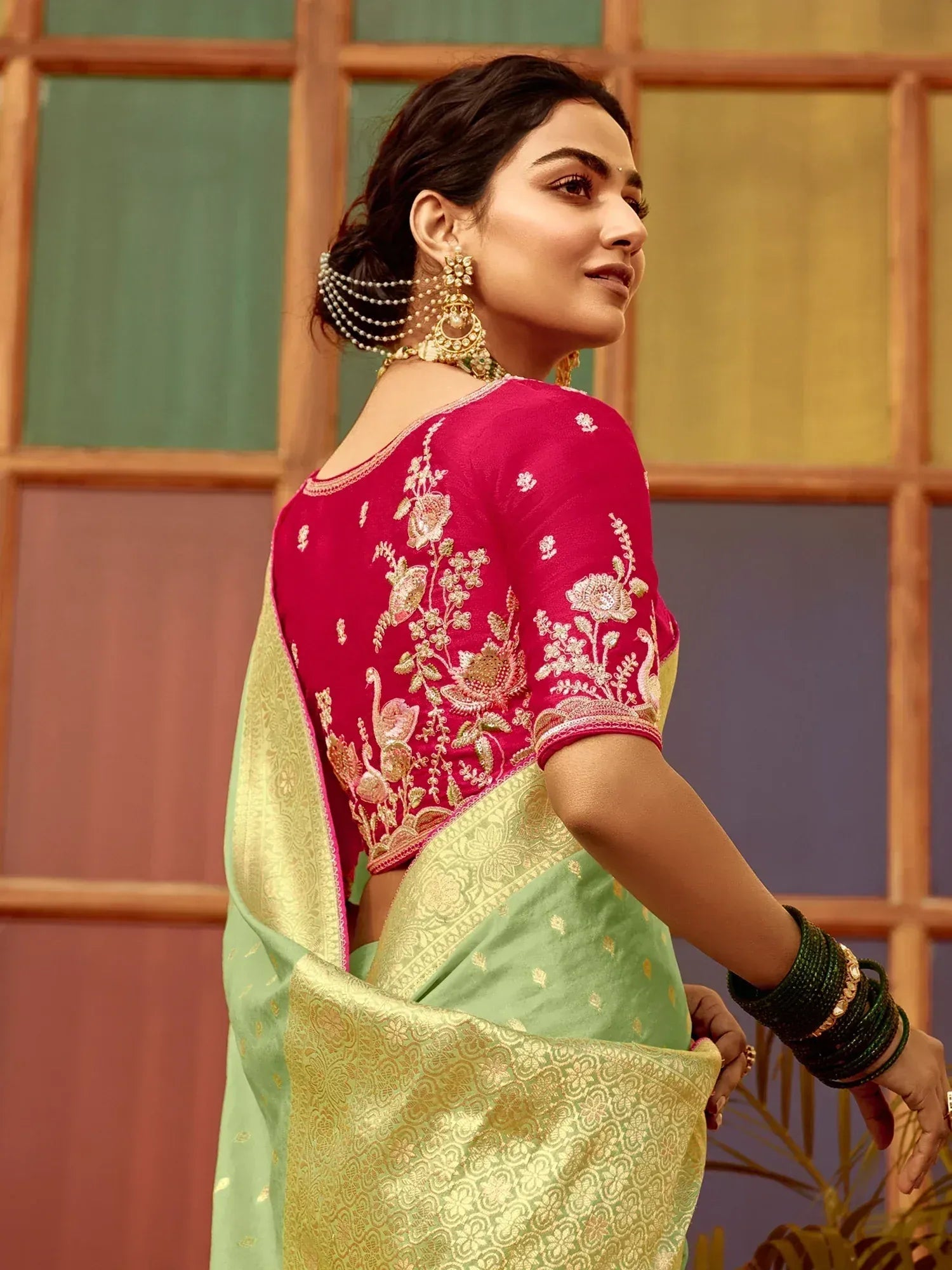 Elegant green saree with pink embroidered blouse, perfect for Indian ethnic wear