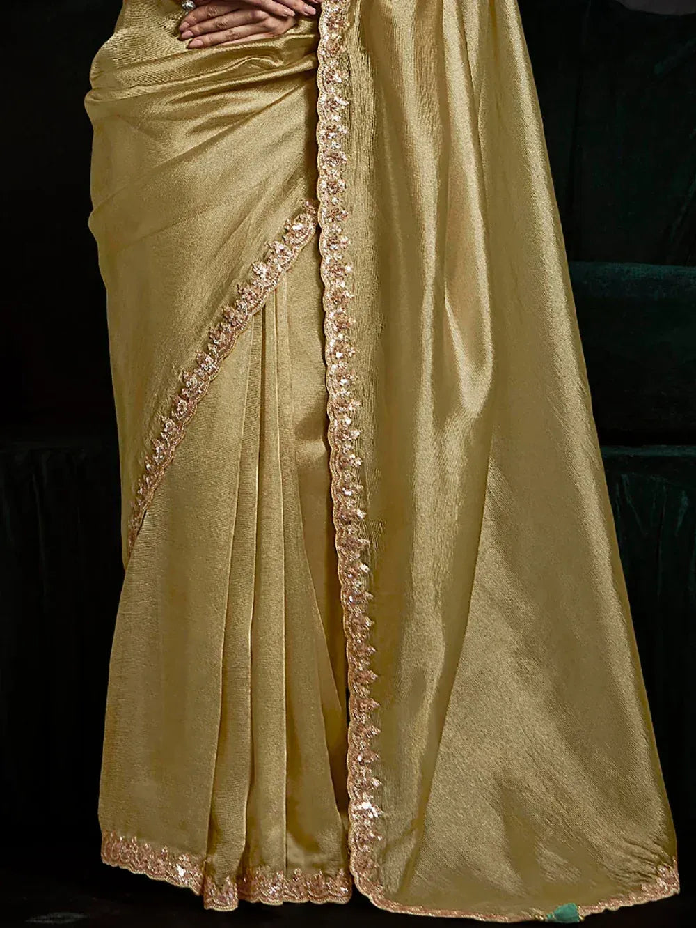 Golden saree with intricate sequin border, elegant Indian ethnic wear for festive occasions