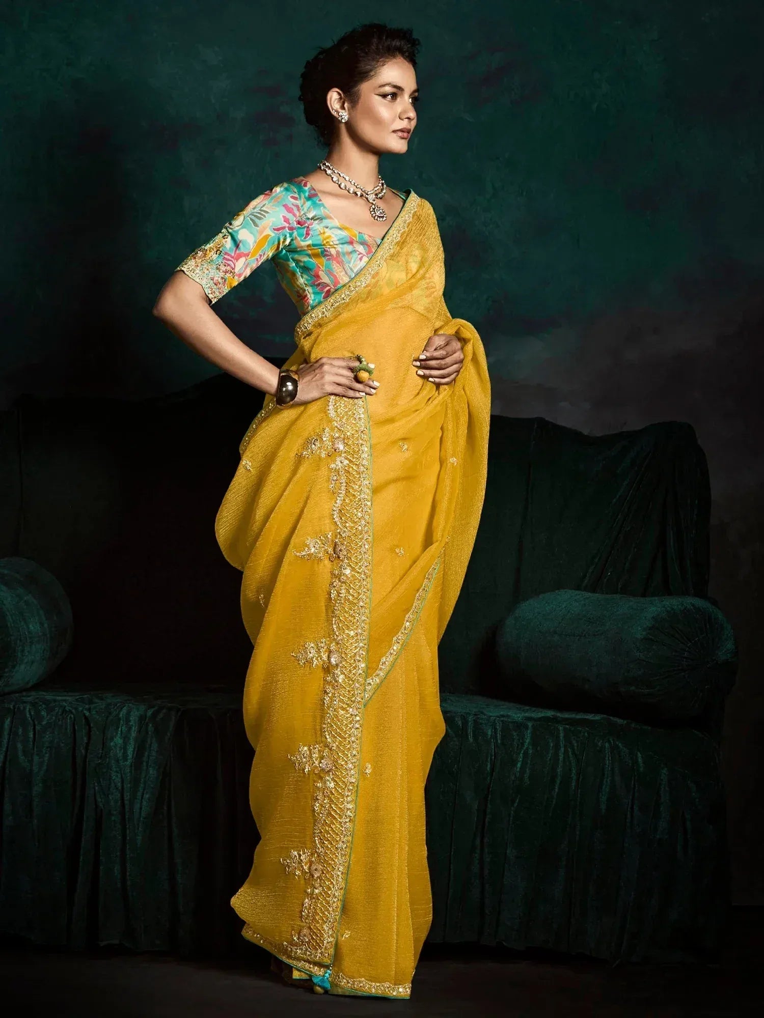 Yellow embroidered saree with floral blouse, perfect for Indian ethnic occasions and festive wear.